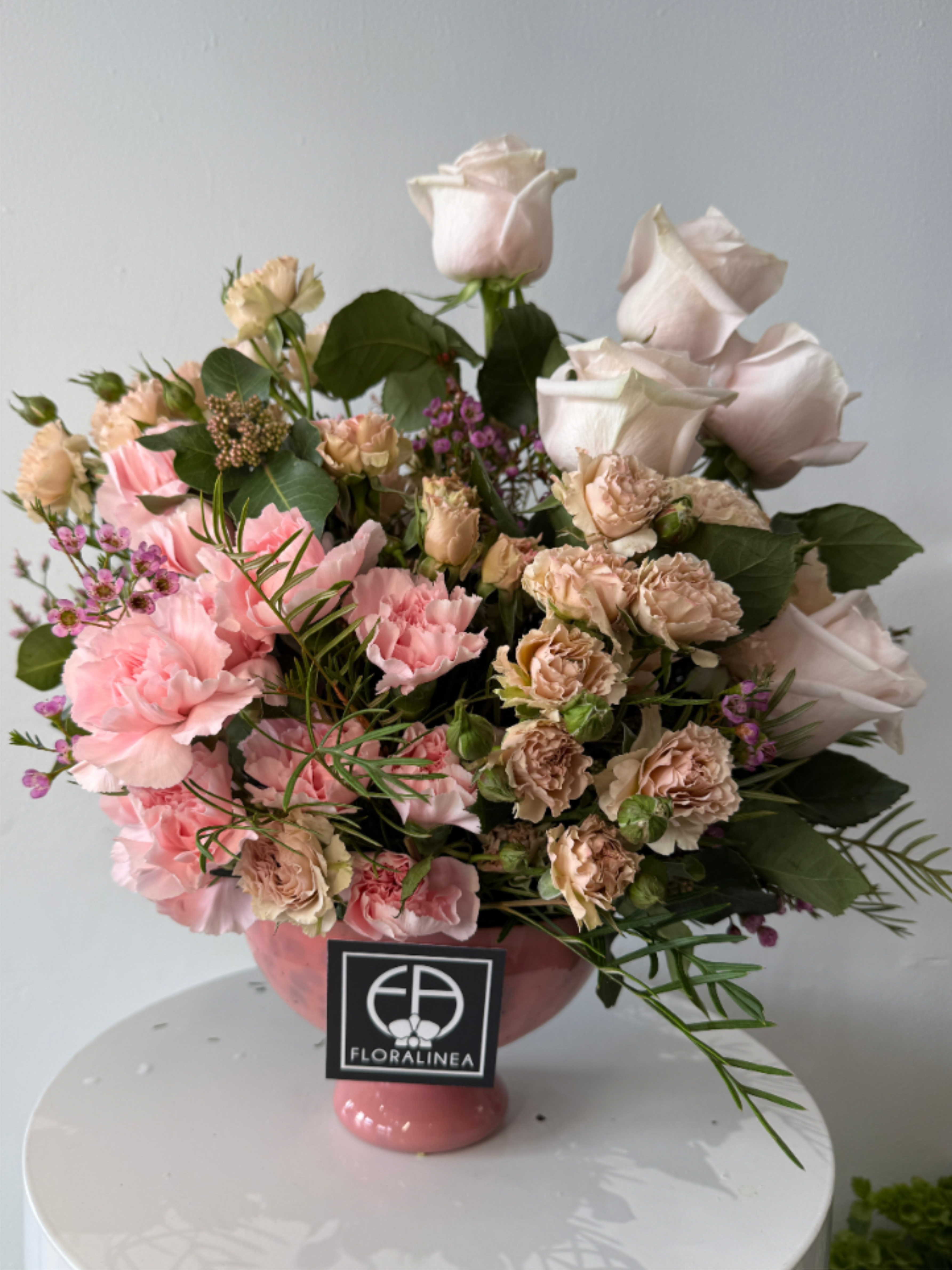 Pink Valentines - Beautiful mix of soft pinks and peaches in a pink vase to make this arrangement a perfect Valentines or just a sweet everyday gift.