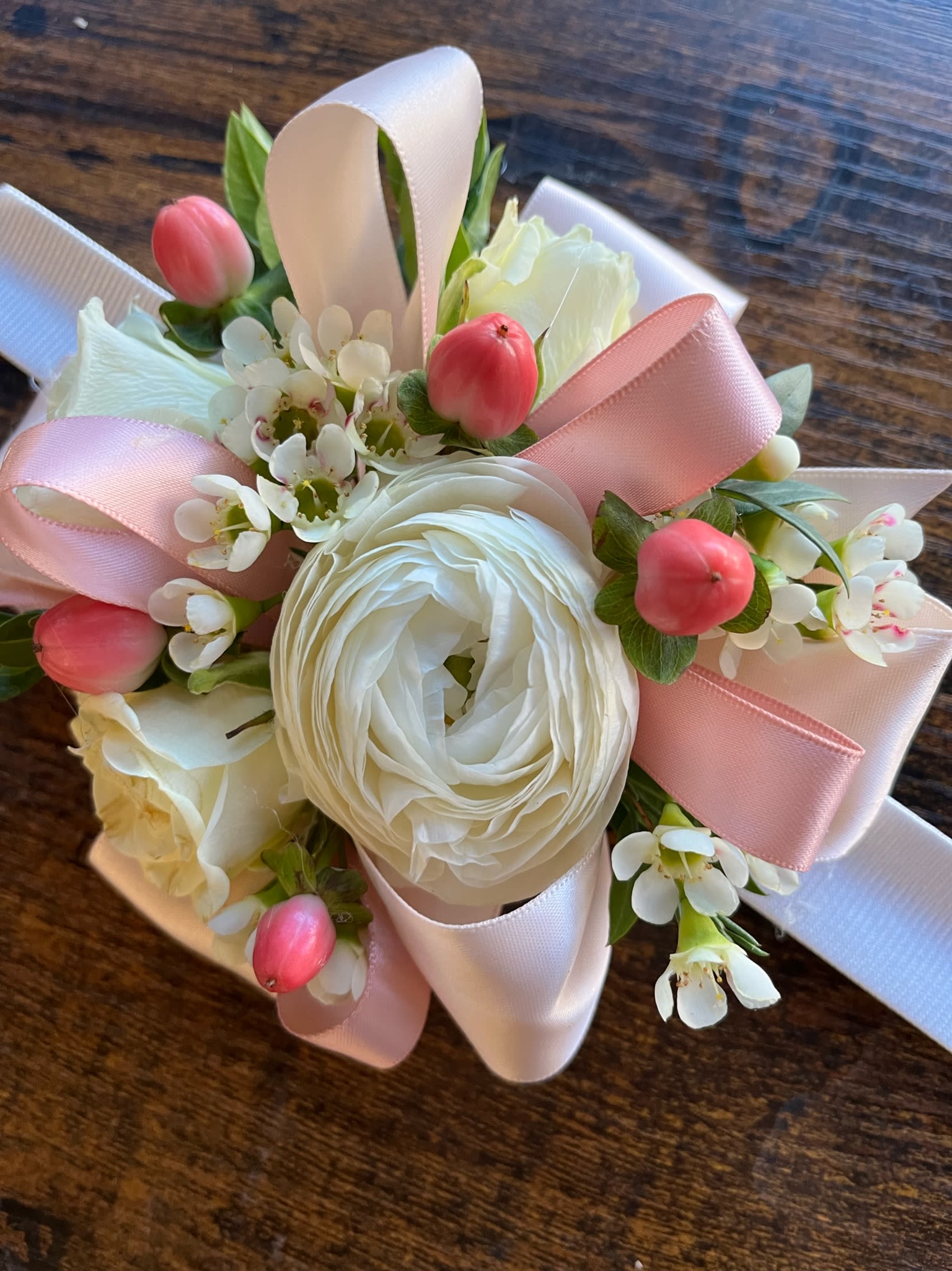 Wrist Corsage #6 Roses, Ranunculus and Hypericum - White ranunculus, white spray roses, hypericum berries, variety of greenery and filler. Please specify ribbon color.
