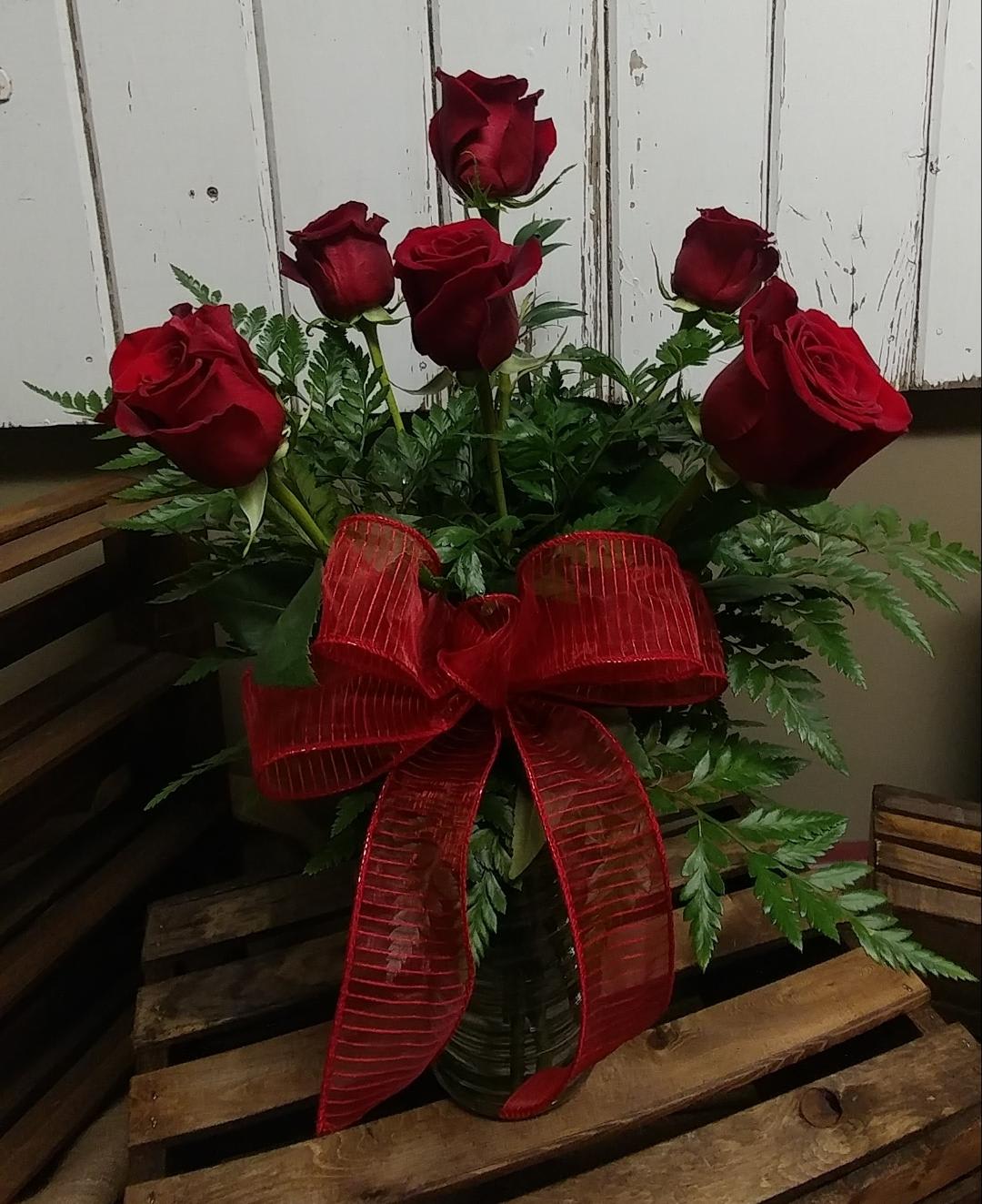1/2 Dozen Roses - 6 Roses included in a vase with mixed Greens.  Available in different colors