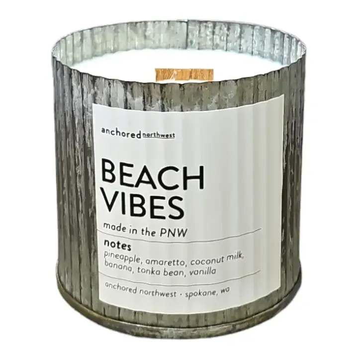 Anchored Northwest - Beach Vibes Candle  -  Beach Vibes Wood Wick Rustic Farmhouse Soy Candle (60 hour burn)  Notes: Pineapple, Amaretto, Coconut Milk, Coconut, Banana, Tonka Bean, Vanilla  Our #1 selling candle container.    Ingredients: 10 ounces poured in a Rustic Vintage container Untreated Cedar Wood Wick 100% Soy Wax grown in the US. Fragrance and Essential Oil Blend Dye and Phthalate free  Anchored Northwest soy wax candles are a great gift for any season, be it Spring, Summer, Fall or Winter. A perfect addition to any home decor.  Our wood wick, triple scented, 100% soy wax candles are hand poured in Spokane, WA. We use real ingredients in our candles - fragrance oils infused with essential oils, 100% American-grown soy wax, and untreated cedar wood wicks.