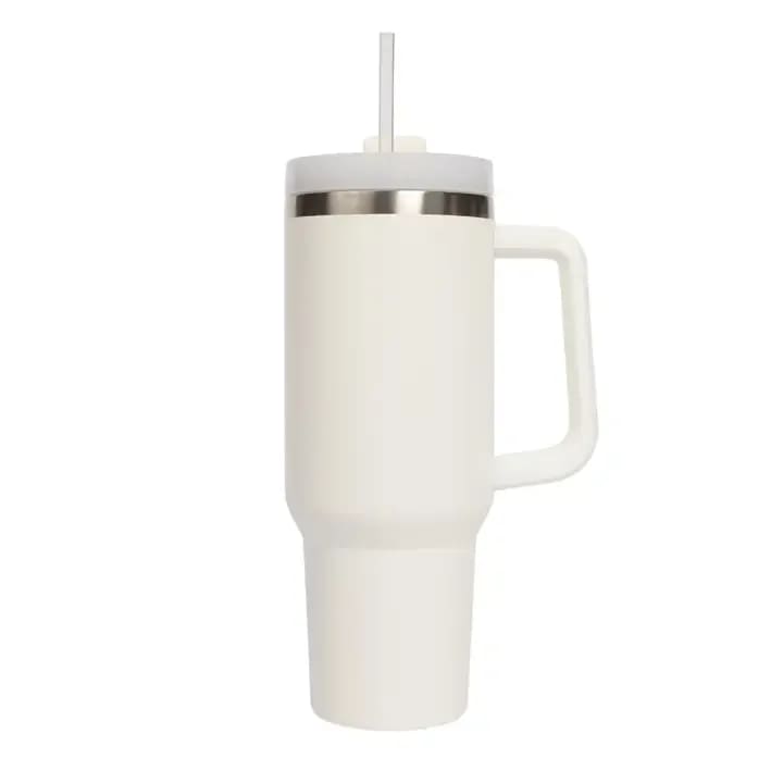 SWD - Cream 40 oz Travel Tumbler - About this product  Our tumblers are the perfect companion for your customer's busiest days, with an easy-carry, comfort-grip handle and a narrow base that fits most cup holders. Perfect for any occasion, our premium stainless steel tumbler holds 40oz of any favorite beverage, keeping it hot for up to 8 hours and cold for up to 24 hours. The straw and lid are BPA-free - plus, our functional lid features a sliding sip cover with three positions: a straw opening, a drink opening, and a full-cover top.  DETAILS:  • 40oz Capacity • Color: Cream • Size: 3" x 3.8" x 10.6" (12.2" w/ straw) • Package Size: 5.2" x 5.2" x 11.6" • BPA Free Lid and Straw • Stainless Steel • Keeps Drinks Hot for Up To 8 Hours; Cold for 24 Hours • Designed in the USA, Imported • Style No. TU003  ITEM CARE:  • Dishwasher Safe • Do Not Microwave • Wash before use and avoid abrasive cloths when cleaning  Categories: Back to School, Drinkware, Portable Drinkware, Stanley, 40 oz Tumbler with Handle, Gifts, Easter Baskets, Birthday