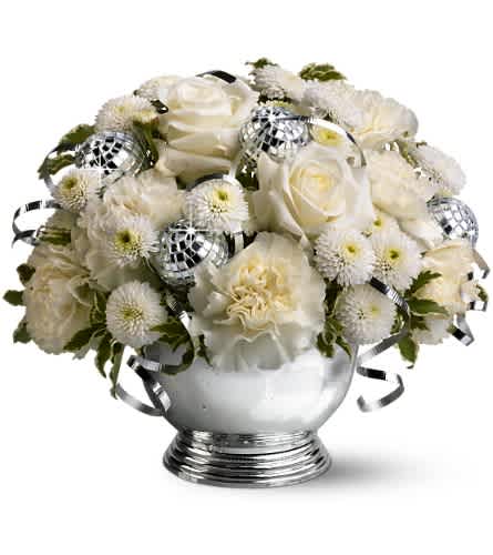 Studio 54 - For a super-chic disco celebration this New Year's, send this fun, fabulous floral display! With its mix of pure white flowers, tiny mirrored disco balls and curling silver ribbons, this bowl of blossoms is the hippest gift in town.    A mix of fresh white flowers such as roses, carnations and button spray chrysanthemums is accented with miniature disco balls and silver ribbons and delivered in a silver-toned bowl.    Approximately 9" (W) x 8" (H)    Orientation: All-Around    As Shown : TFWEB291