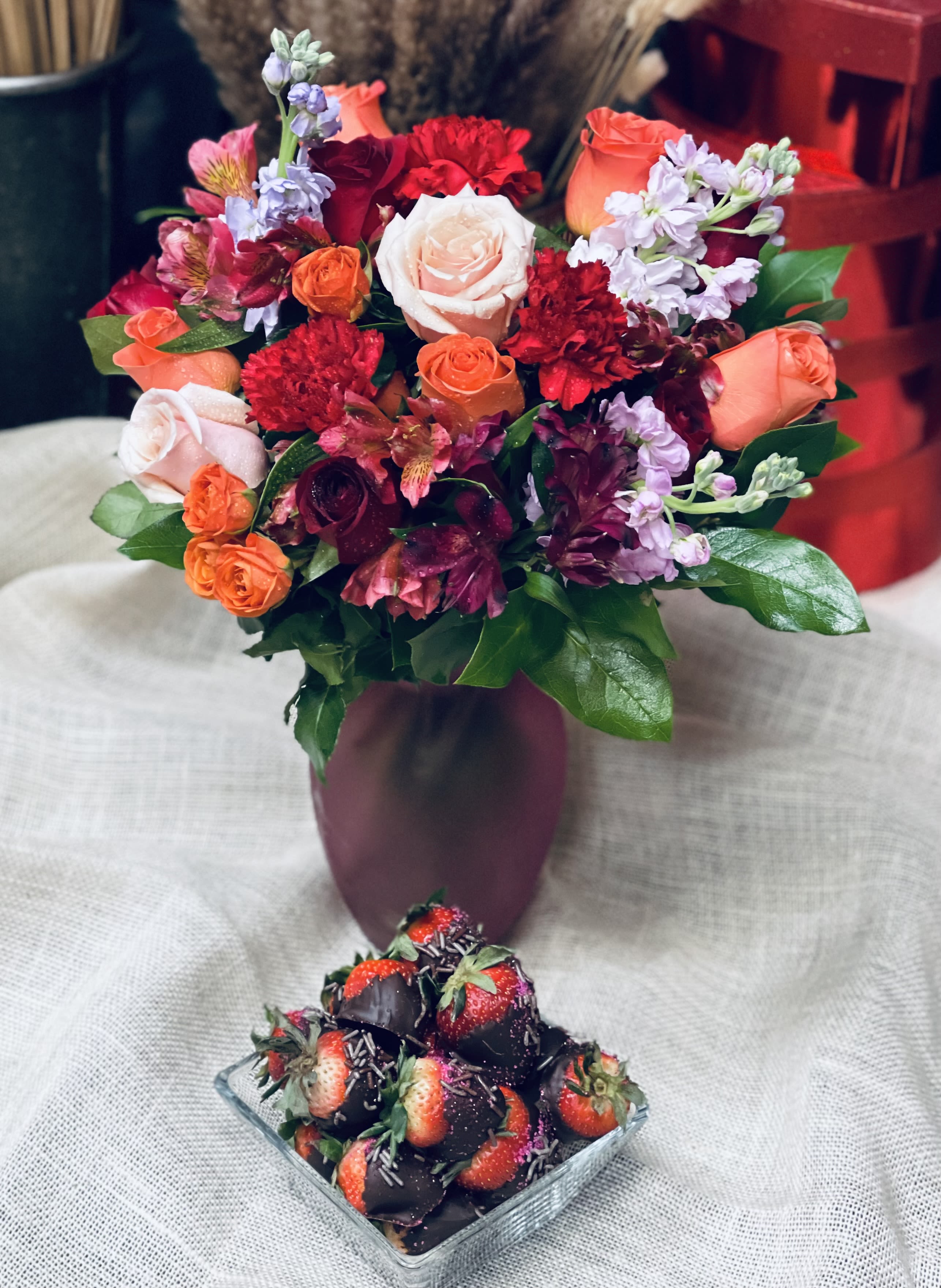 Designer’s Choice&amp; Chocolate Covered Strawberries  - Designer’s Choice with Chocolate-Covered Strawberries Let our talented designers create a one-of-a-kind floral arrangement using the freshest seasonal blooms, thoughtfully selected for beauty and harmony. Paired with indulgent chocolate-covered strawberries, this luxurious gift is a delightful surprise that combines elegant florals with a sweet treat. Perfect for Valentine’s Day, birthdays, or just because, this designer’s choice arrangement adds an element of excitement and romance—no two designs are ever the same, but each one is made to impress.