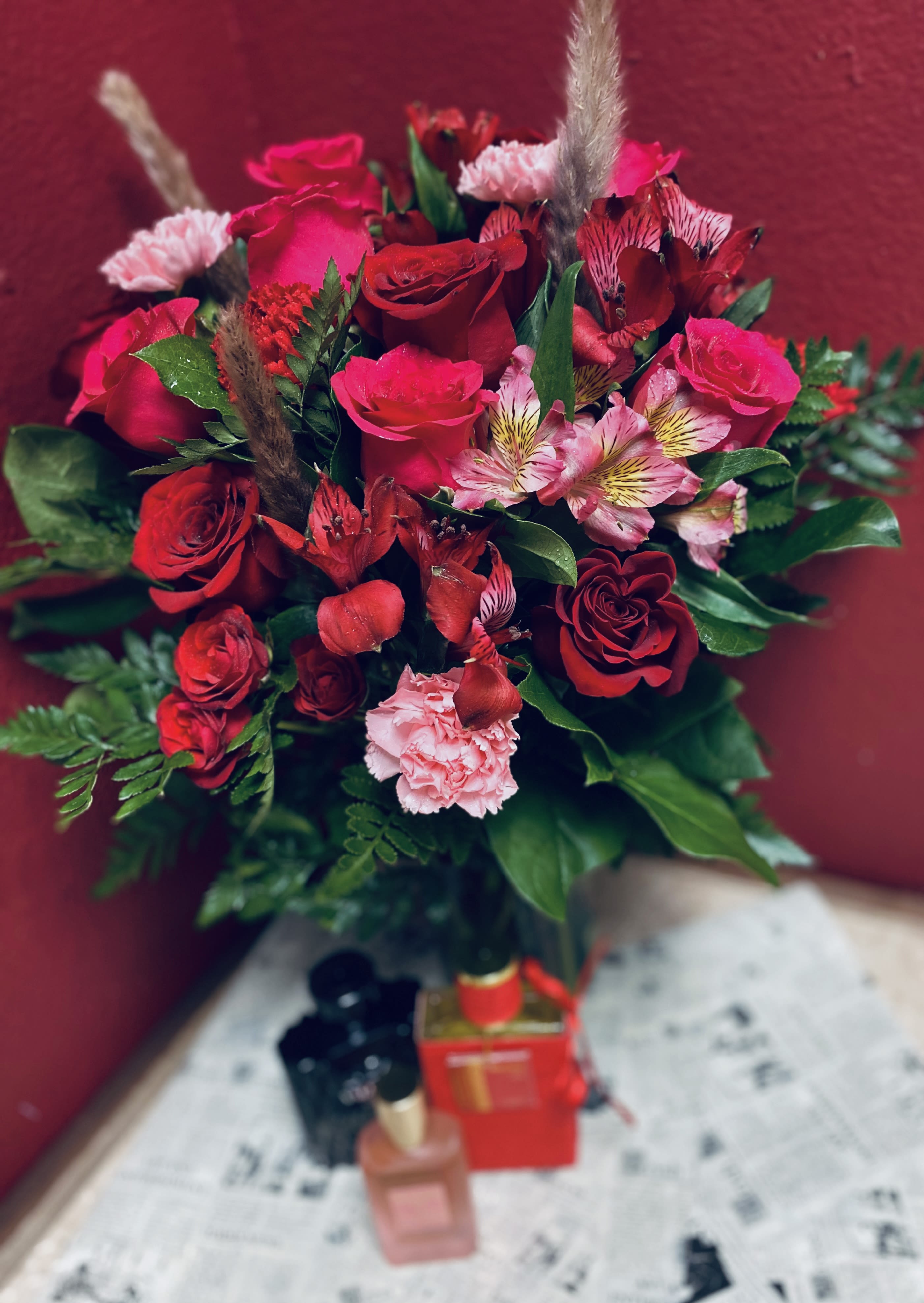 Red Designer’s Choice with Dubai Fragrance - Red Designer’s Choice with Dubai Fragrance Make a bold and unforgettable statement with our Red Designer’s Choice arrangement, expertly crafted using rich red blooms hand-selected by our talented florists. Each arrangement is uniquely designed to express passion, elegance, and timeless beauty. Paired with a luxurious fragrance imported from Dubai—available in women’s, men’s, or unisex options chosen by the customer—this gift adds an exotic and refined touch. Perfect for Valentine’s Day, anniversaries, or special celebrations, this stunning combination of florals and fragrance is designed to captivate the senses and leave a lasting impression. Please in special instructions specify women, men or unisex fragrance and we will pick you the best aroma. 