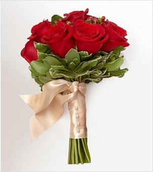 Rich Reds Flower Girl/Junior Bridesmaid Bouquet - This petite hand tied bouquet of red and dark red roses and hypericum berries is perfect for a flower girl or junior bridesmaid. Other colors may be available upon request. This is not available for same day delivery.