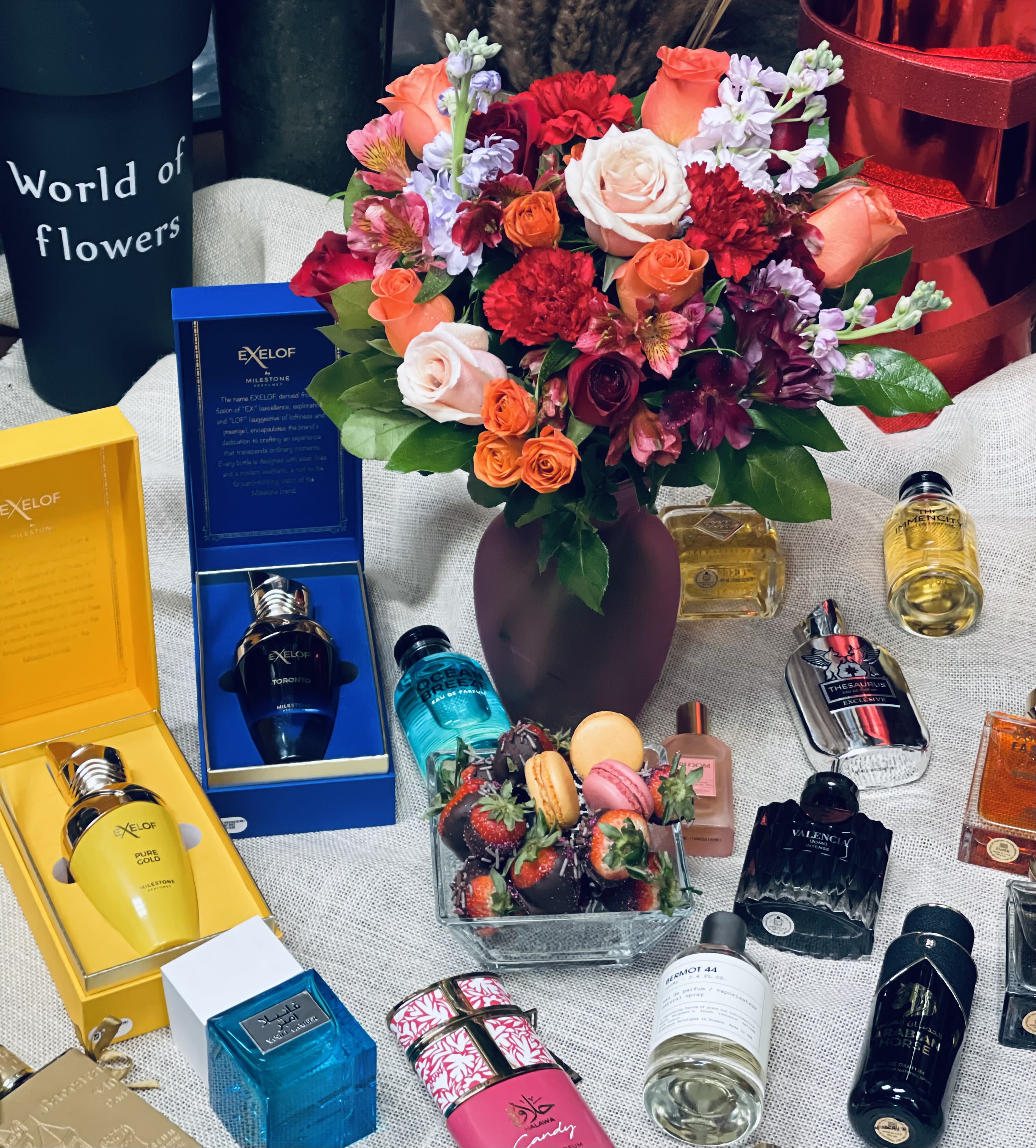 Designer’s Choice Sweets &amp;Treats with Dubai Fragrance - Designer’s Choice Sweets &amp; Treats with Dubai Fragrance Delight the senses with our Designer’s Choice arrangement, thoughtfully curated with a charming assortment of sweets and treats including colorful macarons, decadent chocolate-covered strawberries, and irresistible cupcakes. Each selection is beautifully paired with a luxurious fragrance imported from Dubai, available in women’s, men’s, or unisex options chosen by the customer. Perfect for celebrations, romantic surprises, or indulgent gifting, this one-of-a-kind combination blends sweetness, elegance, and exotic fragrance for a truly unforgettable experience.  please specify in instruction box men, women or unisex fragrance. 