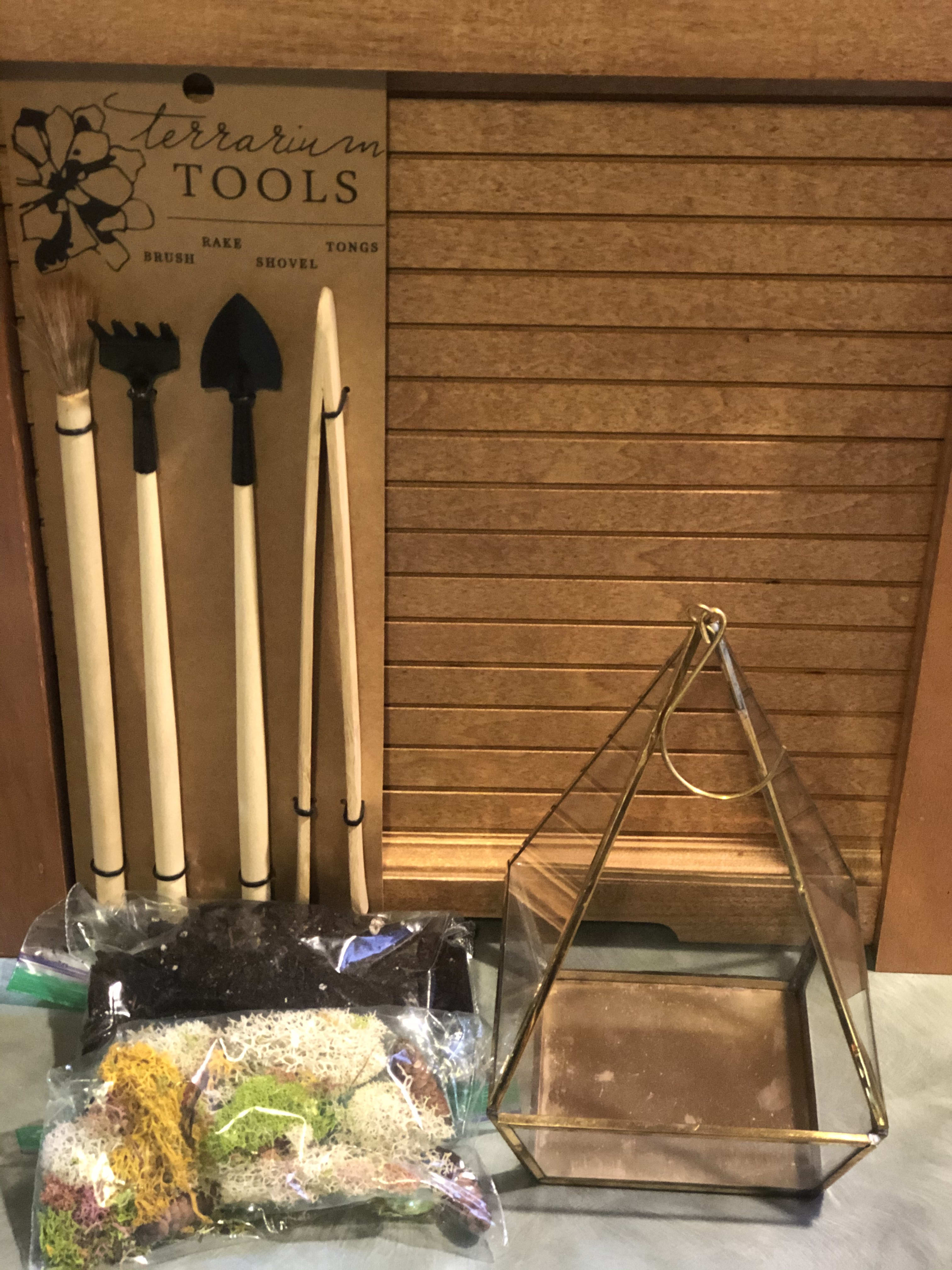 DIY Terrarium Kit - For the person that loves to create. There very own DIY Terrarium Kit.  Kit contains: Terrarium tools, 1 Succulent of our choice for you to plant. Glass terrarium, soil mixed with fertilizer for 1 year of growth,  colored moss and a few glass pebbles. Terrarium is 8" tall and 5" square at the base. hanging hook attached.