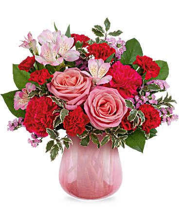 Sweet On Hue Bouquet - Radiating soft sophistication, the Pretty In Petal Bouquet blends pink roses, alstroemeria, and carnations in a translucent crackled glass vase with a pink gradient-a chic and heartfelt Valentine's Day gift for your one and only. Bouquet features hot pink roses, pink spray roses, pink alstroemeria, pink miniature carnations, white sinuata statice, dusty miller, huckleberry, and leatherleaf fern arranged in the Sweet On Hue Vase-a translucent glass vase with a crackled pink gradient. Approximately 13 1/2" W x 13 1/2" H