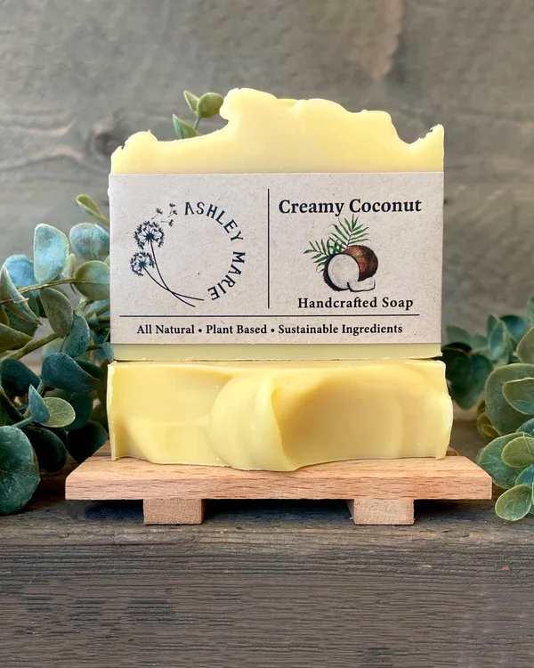 Ashley Marie - Creamy Coconut - Coconut milk is packed with C, E and B vitamins. Coupled with a healthy lauric acid content, coconut milk makes a great moisturizer. This soap is super fatted with organic, non-gmo coconut milk resulting in a very unique creamy lather. This makes a great facial soap or general body soap that would particularly benefit most dry skin conditions. It is also made with a refreshing, tropical essential oil blend because there is not a natural way to make the scent of coconut come through when we mix the oils with lye. So keep in mind it does NOT smell like coconut but it smells amazing! 