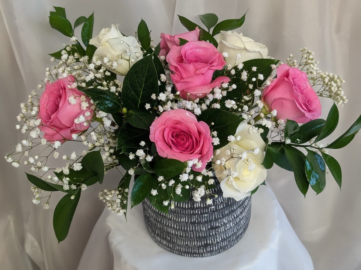 Sweet Love  - Beautiful pink and white roses with a touch of babies breath and greenery in a modern distressed vase. 