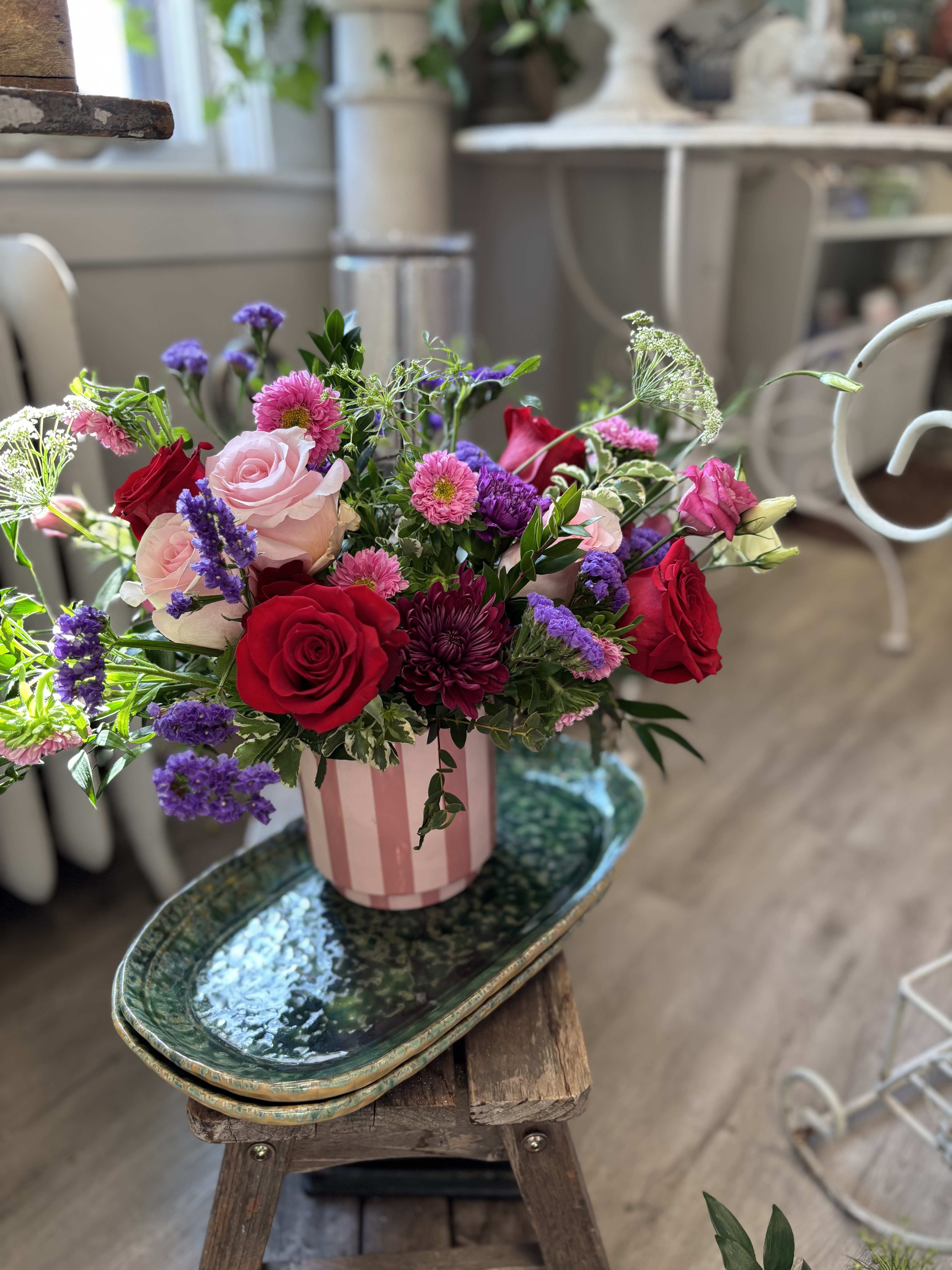 Deluxe Valentine's Designer's Choice Arrangement  - Make an impression with our deluxe arrangement for Valentine's Day. Featuring sumptuous roses, tulip, hydrangea and other glorious stems this selection is sure to "wow!" Please note this arrangement may vary in color from what is shown as this is a designer's choice - This means we pick our BEST and FAVORITE stems. This arrangement is perfect on a dining room table, foyer sideboard or anyway where you want to make an impression.  Approx. 16 x16 