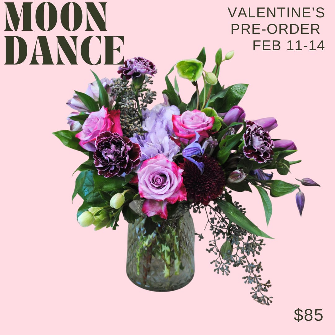 Moon Dance - Purple - A primarily purple toned arrangement in a glass vase!   Deluxe and premium price points will have additional blooms added