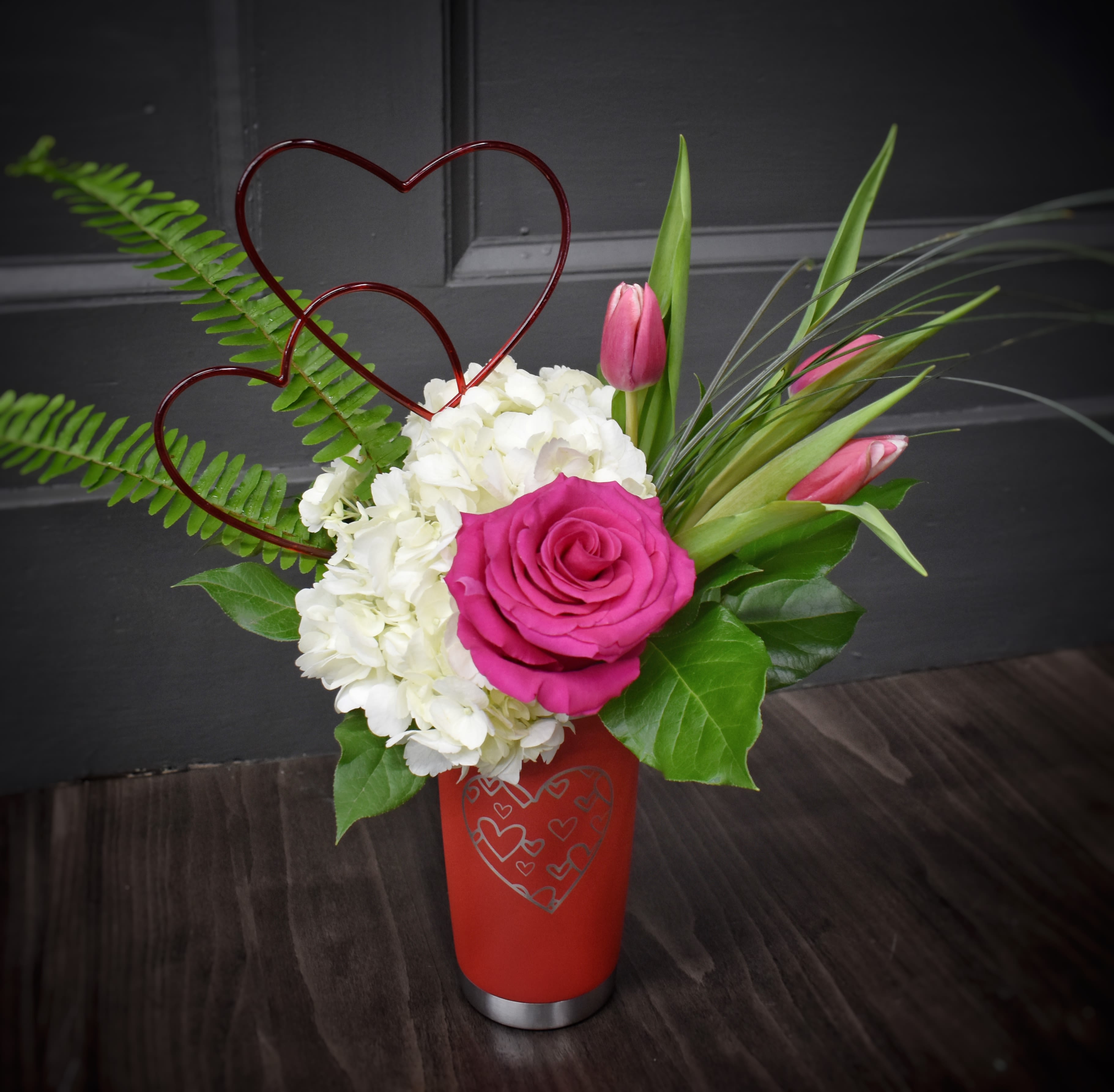 Perfect Together- Thermal Mug Bouquet - What's better than valentine flowers and a thermal coffee mug together? Not much! This thermal valentine mug comes with tulips, a hydrangea and a rose or you can upgrade to the deluxe or premium to add carnations, more tulips and another rose.