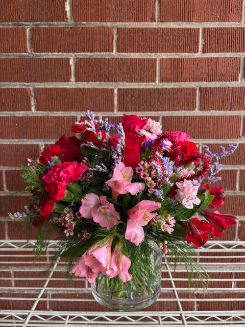 CUPID - THIS ROMANTIC FRESH CUT FLORAL ARRANGEMENT IS FILLED WITH BRIGHT COLORS THAT IS SURE TO ROMANCE YOUR SPECIAL SOMEONE. CUPID IS A GREAT ARRANGEMENT TO SHOOT AN ARROW RIGHT TO THE HEART.