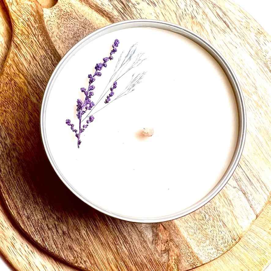 French Lilac Botanical Soy Candle 4 oz  - Hand poured, artisanal soy candle: French Lilac captures the serene beauty of a field of lilacs in peak bloom, with notes of green leaves, lily of the valley, honeysuckle blossoms, clean powder and woody amyris. Decorated with delicate sprigs of dried florals. Three tin sizes available, round brand label, made from soy wax, cotton wick, &amp; phthalate free fragrance. 2 oz tins measure 2.05 inches wide, 1.38 inches tall. 4 oz. tins measure 2.4 inches wide and 1.8 inches tall. 8 oz. tins measure 3.2 inches wide and 2 inches tall.  Keep candle free of debris and wick trimmings. Most or all of the floral and botanical decor may need to be removed before burning, especially those pieces closest to the wick. Trim wick to 1/8-1/4 inch before each use. Never leave burning unattended or within reach of children or pets. Burn in a draft free area on heat safe surface. 