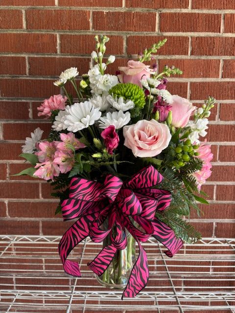 WICKEDLY BEAUTIFUL - A TRULY WICKED MIX OF PINK FLOWERS, WHITE ACCENTS, AND GREENERY- CHARMING, DRAMATIC, AND MAGICALLY STYLED IN A VASE. 