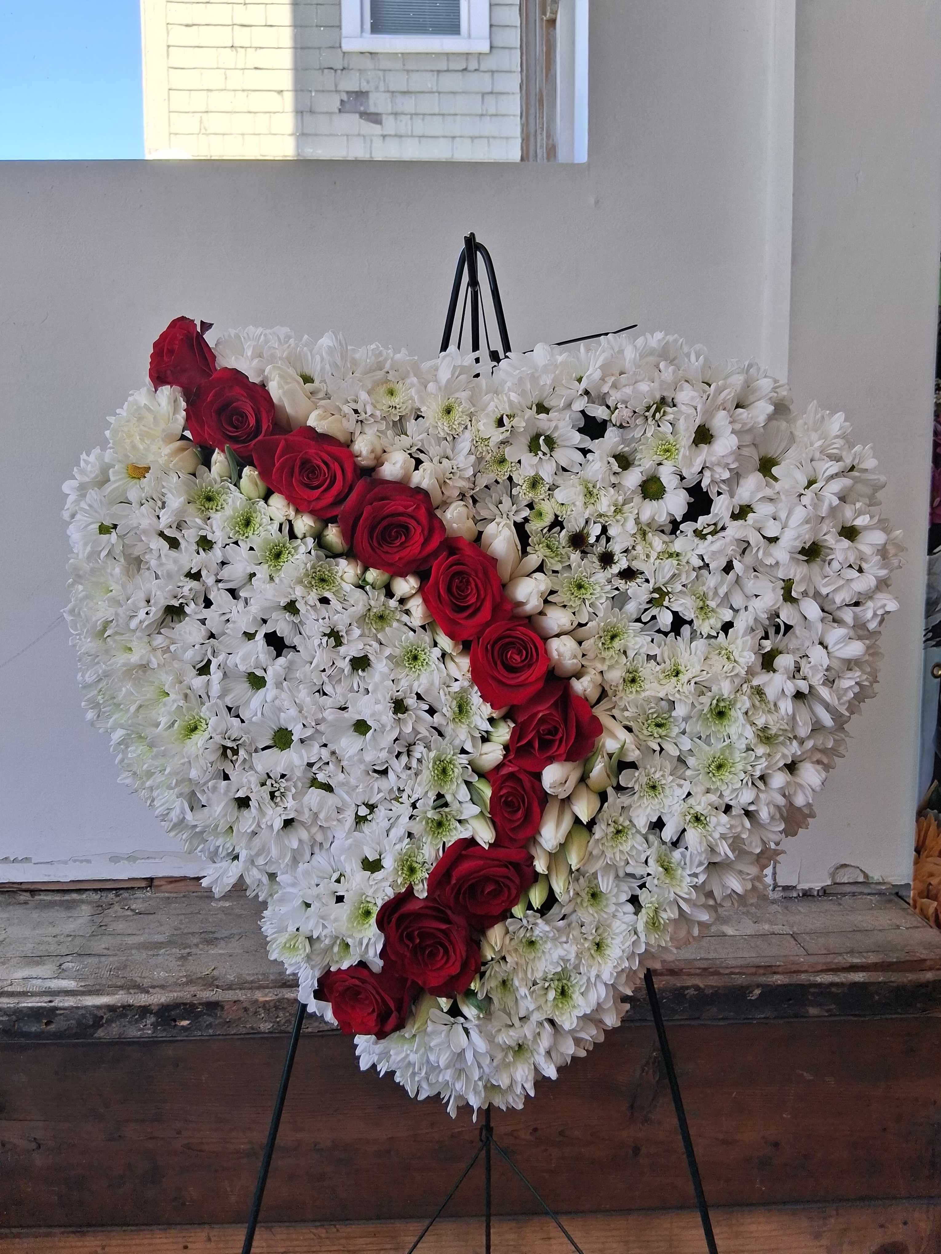 The river of sorrow - White daisies and red roses heart shaped standing spray  