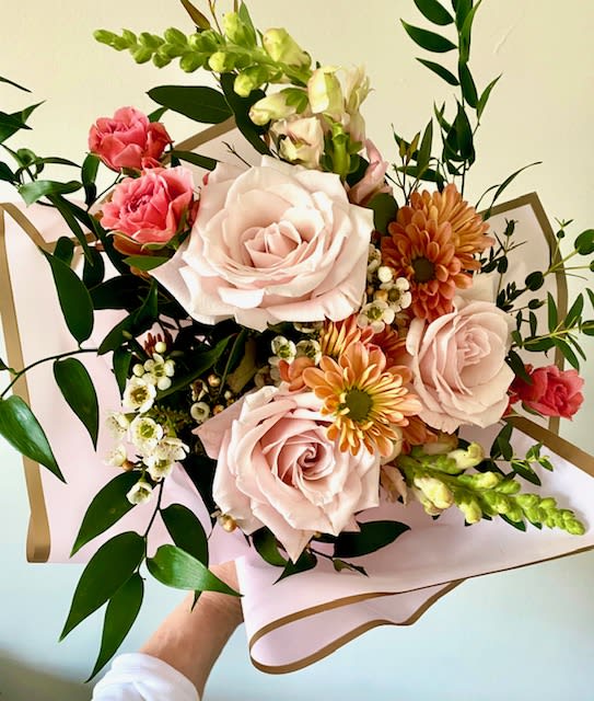 Valentine’s Day Designer’s Choice Wrap: Blush Wrap - Vintage inspired melange of blooms in shades of pale pink, coral and peach choose a wrap or vased arrangement. 