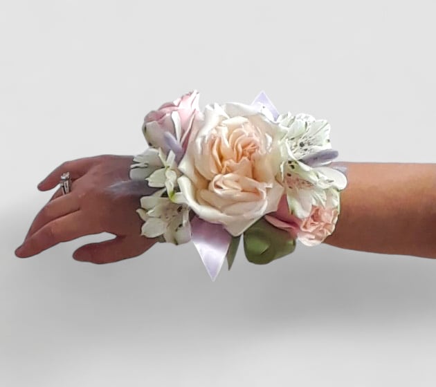 Corsage Beauty Designer's Choice - Lovely roses and orchids arranged for the wrist. All fresh flower designs that leave my flower shop studio are works of art. Please visit my beautiful gallery to see my latest designs that I have created for my online customers. Stand out in the crowd with a gorgeous wristlet at prom.