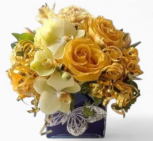 Yellow Beautiful Bouquet Designer's Choice - Made unique and different each time from my beautiful blossom selection of that day. Perfect for every occasion. Send this beauty today to show them how much you care with it's beautiful mixed yellow, cheerful blossoms of that day roses and orchids arranged in a black, modern, glass cube vase. All fresh flower bouquets that leave my flower studio are works of art. Send them a special bouquet to make them smile.