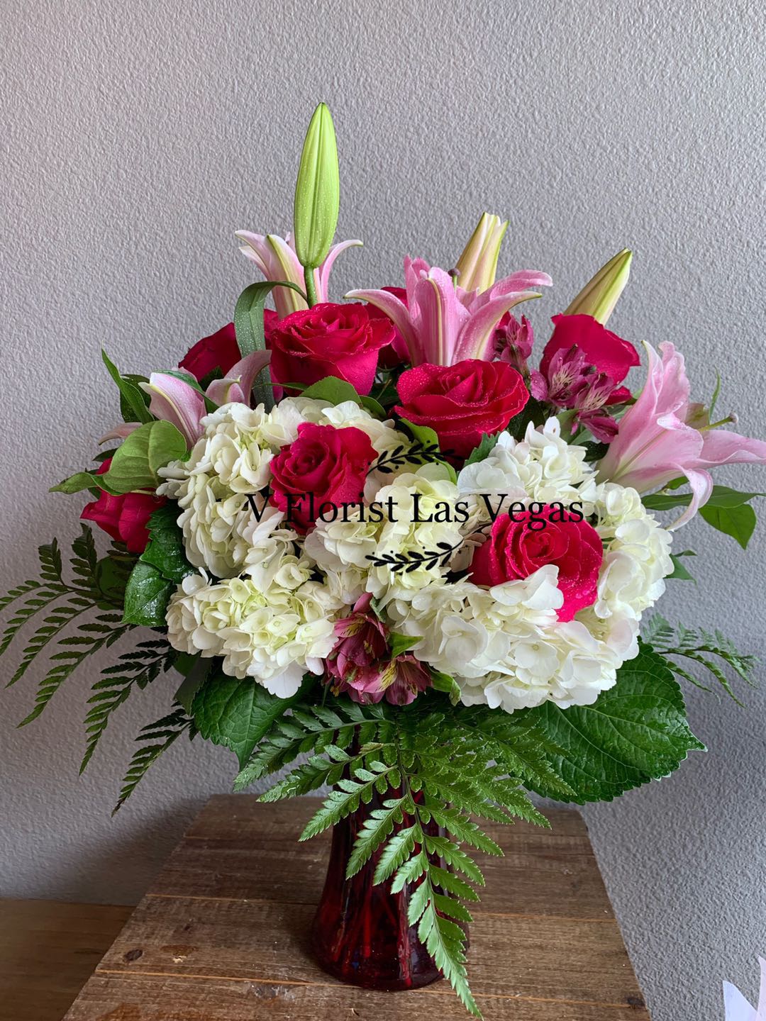 Treasure Bouquet - Express your love to the one you treasure. Selection of hot pink roses with lilies and Hydrangeas joined together to show your love Colors and selections based on seasons, Colors of flowers are subject to change with a similar color frame.