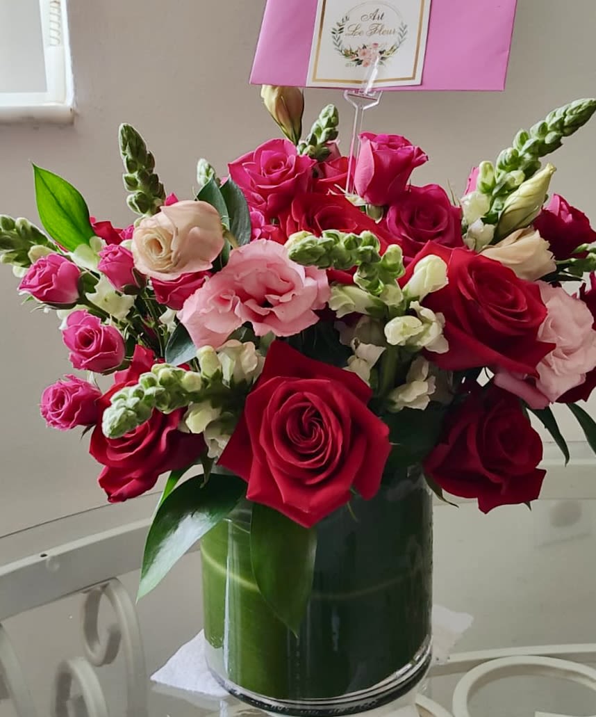 Timeless Love - A warm, romantic arrangement of red roses, soft pink Lydianthus, hot pink spray roses, and snapdragons, finished with fresh greenery. Sweet, vibrant, and full of love—perfect for Valentine’s Day or a romantic occasion️