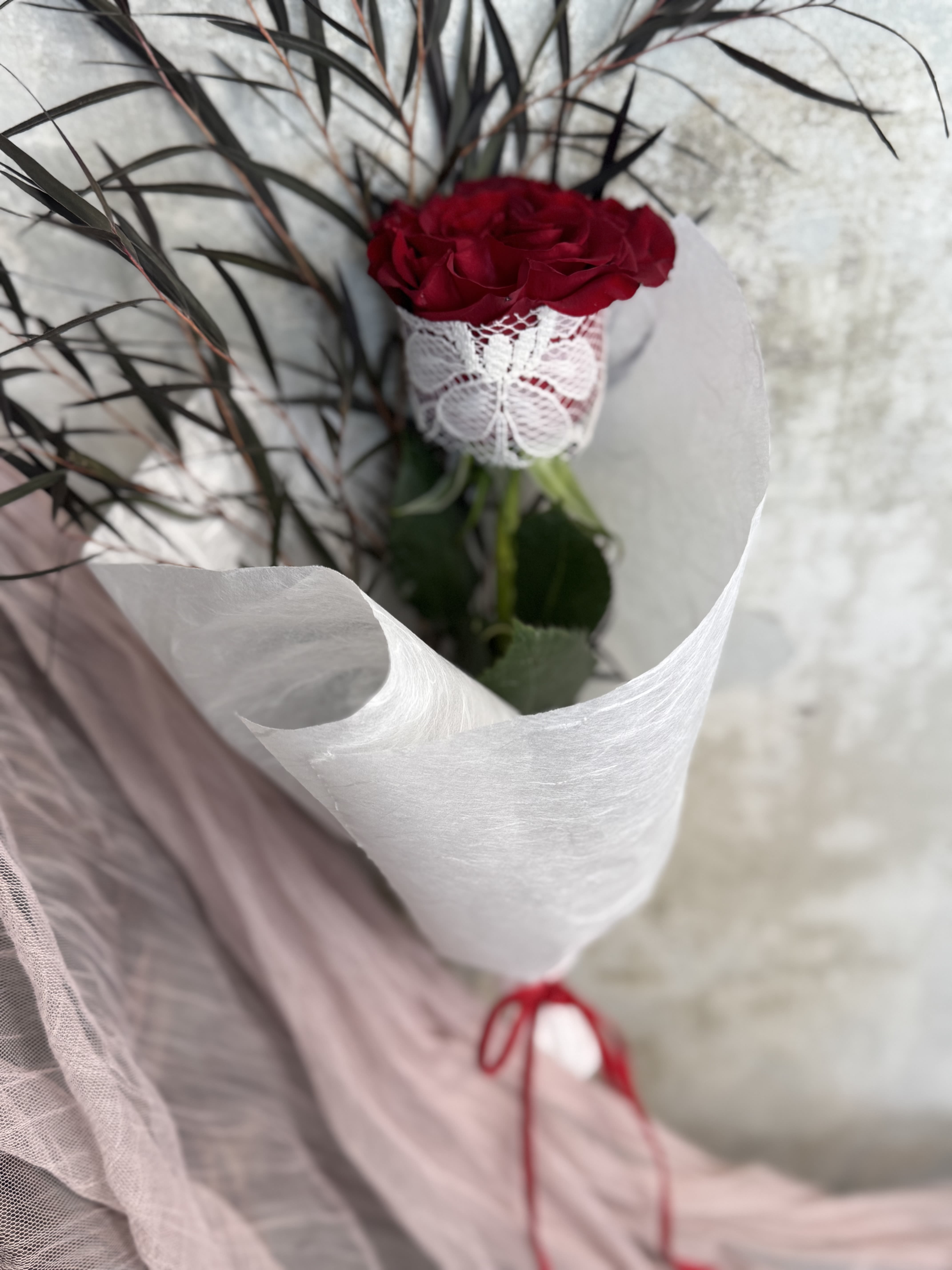 (Valentine's Day) The Lacey Rose - PICKUP + PREORDER ONLY! - New offering for Valentine's day this year! The Lacey Rose is a single red rose chosen with intention. Wrapped in vintage, upcycled lace sourced locally, layered with Korean mulberry paper, and finished with a red velvet shoestring bow.  Available for preorder and pickup only!