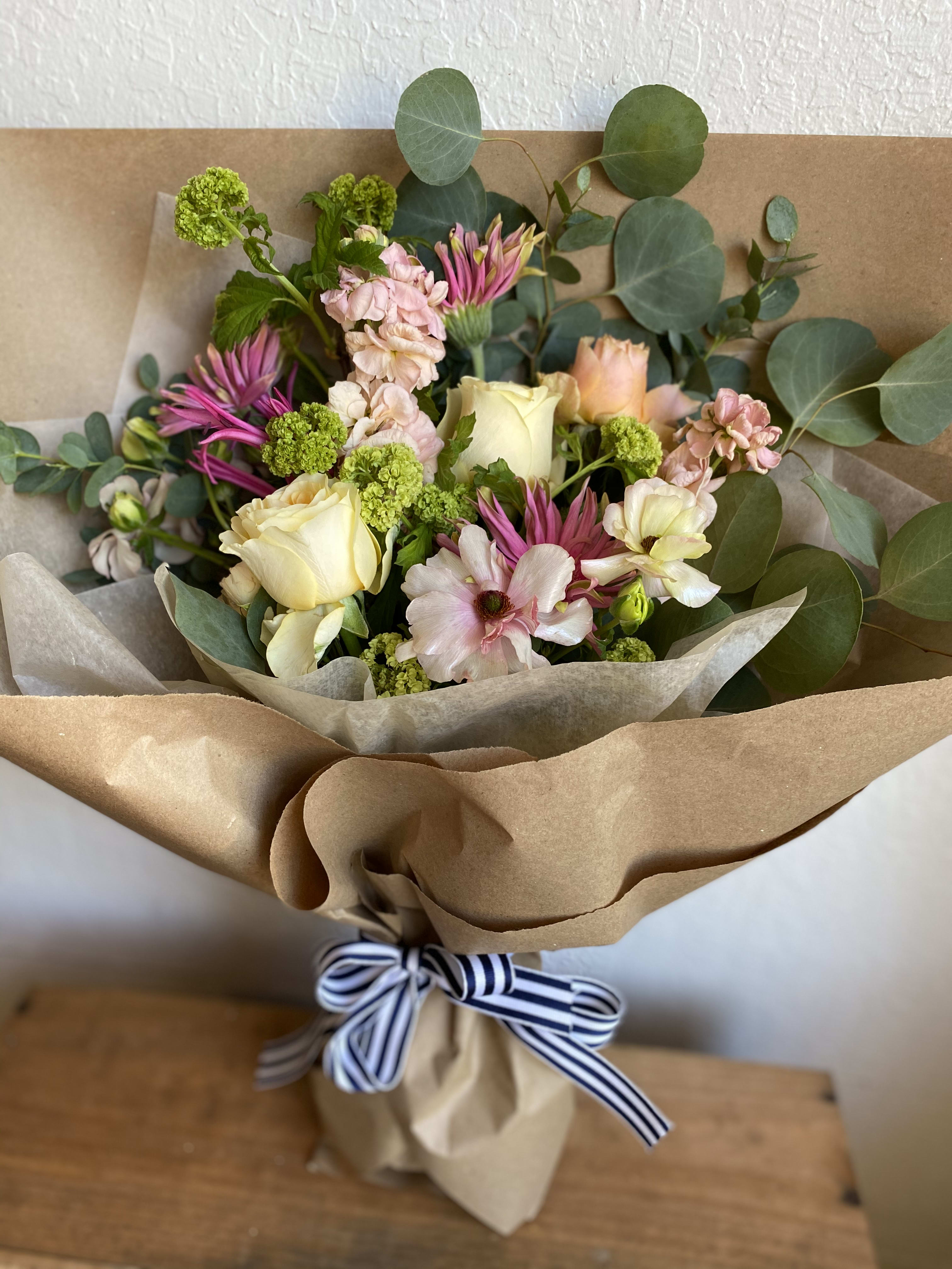 Daily Special - At Momo's Flowers and More every day can be a Flowerful Day! Hand wrapped with love and care, the "Daily Special" bouquet varies but is always lovely, charming with a little something whimsical that you can only get from Momo. Enjoy!