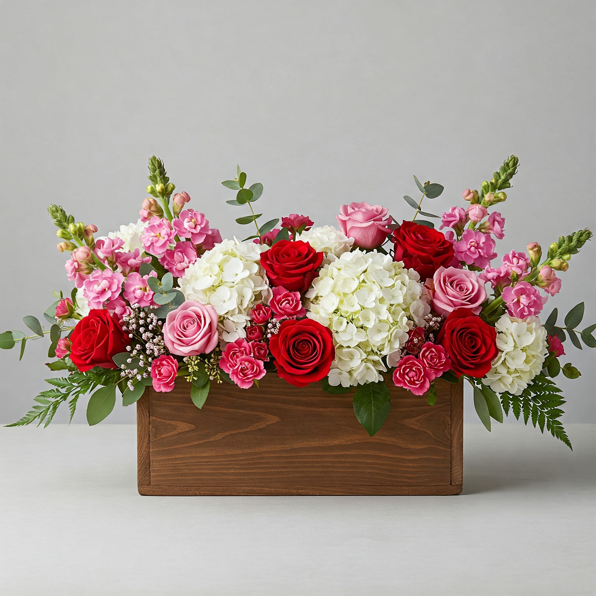 Fanciful Box of Blooms - Send them the bouquet they REALLY want! A lovely overflowing box of delicate blooms to say the 3 magic words... I Love You!   