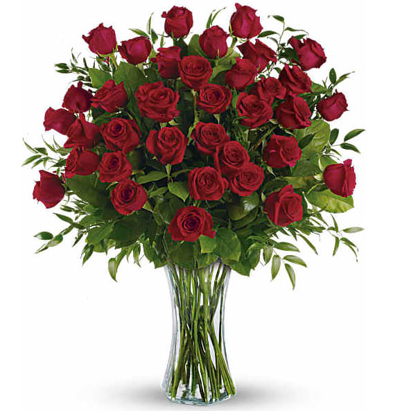Breathtaking Beauty - 3 Dozen Long Stemmed Roses - Wow, wow, wow! Three dozen spectacularly gorgeous red roses artistically arranged in a dazzling flared glass vase. This amazing bouquet is called "Breathtaking Beauty," and it is more than worthy of the name. Someone is going to be speechless.   This impressive bouquet includes 36 red roses accented with assorted greenery.  Delivered in a flared glass vase.