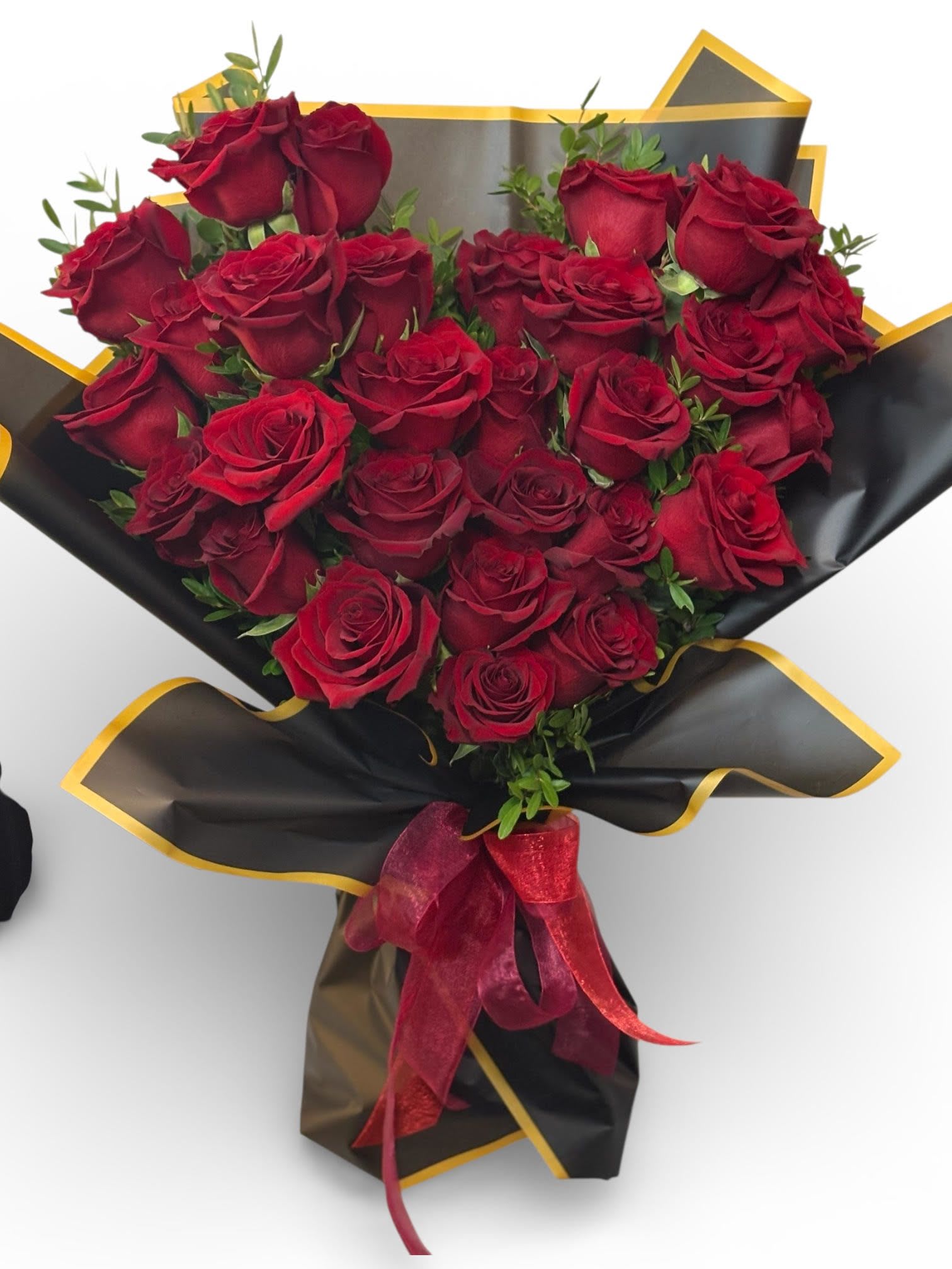 Heart of Roses - 28 stunning roses hand tied in to a heart, sure to impress, and show your love or admiration.