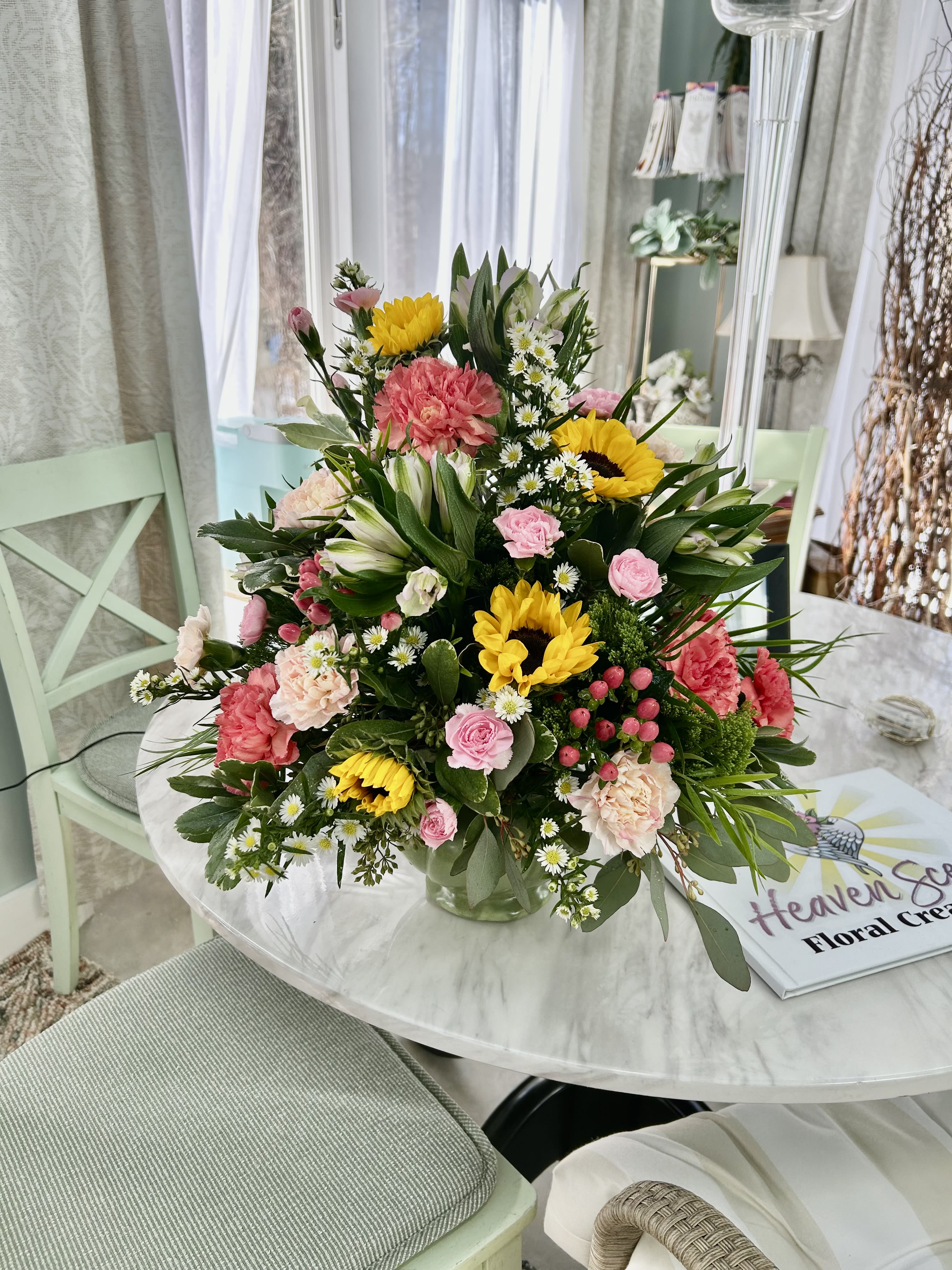 Sunny days - A vase arrangement of sunflowers, hypericum, mini carns, roses,  alstromeria and eucalyptus