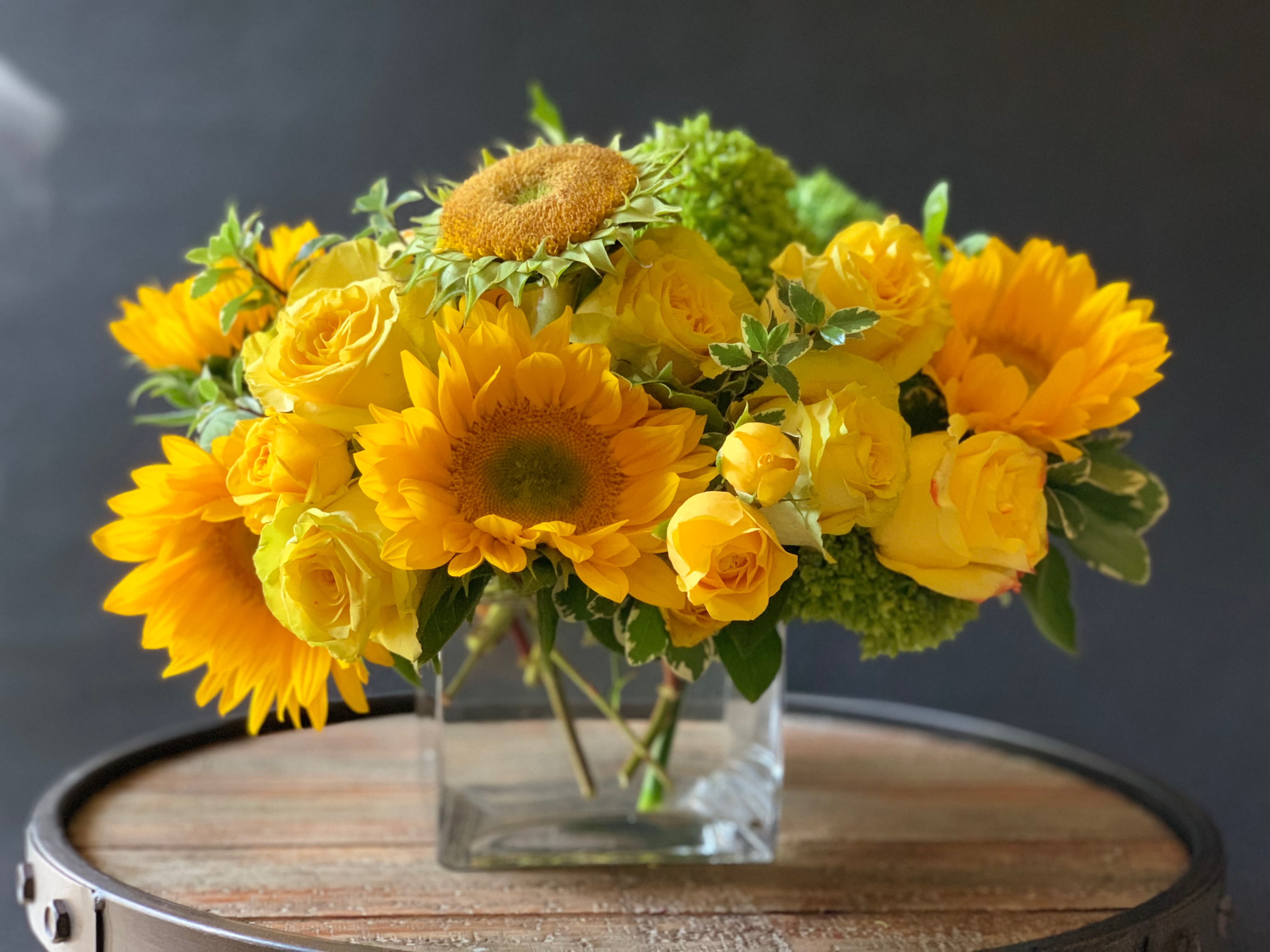 TUSCANY - “And the yellow sunflower by the brook, in autumn beauty stood.” ― William Cullen Bryant. You know the Earth laughs in flowers when you see sunflowers everywhere. Our Tuscany designed showcases  roses, yellow spray roses, beautiful sunflowers and other textures.  *Picture showcases our Delux version.