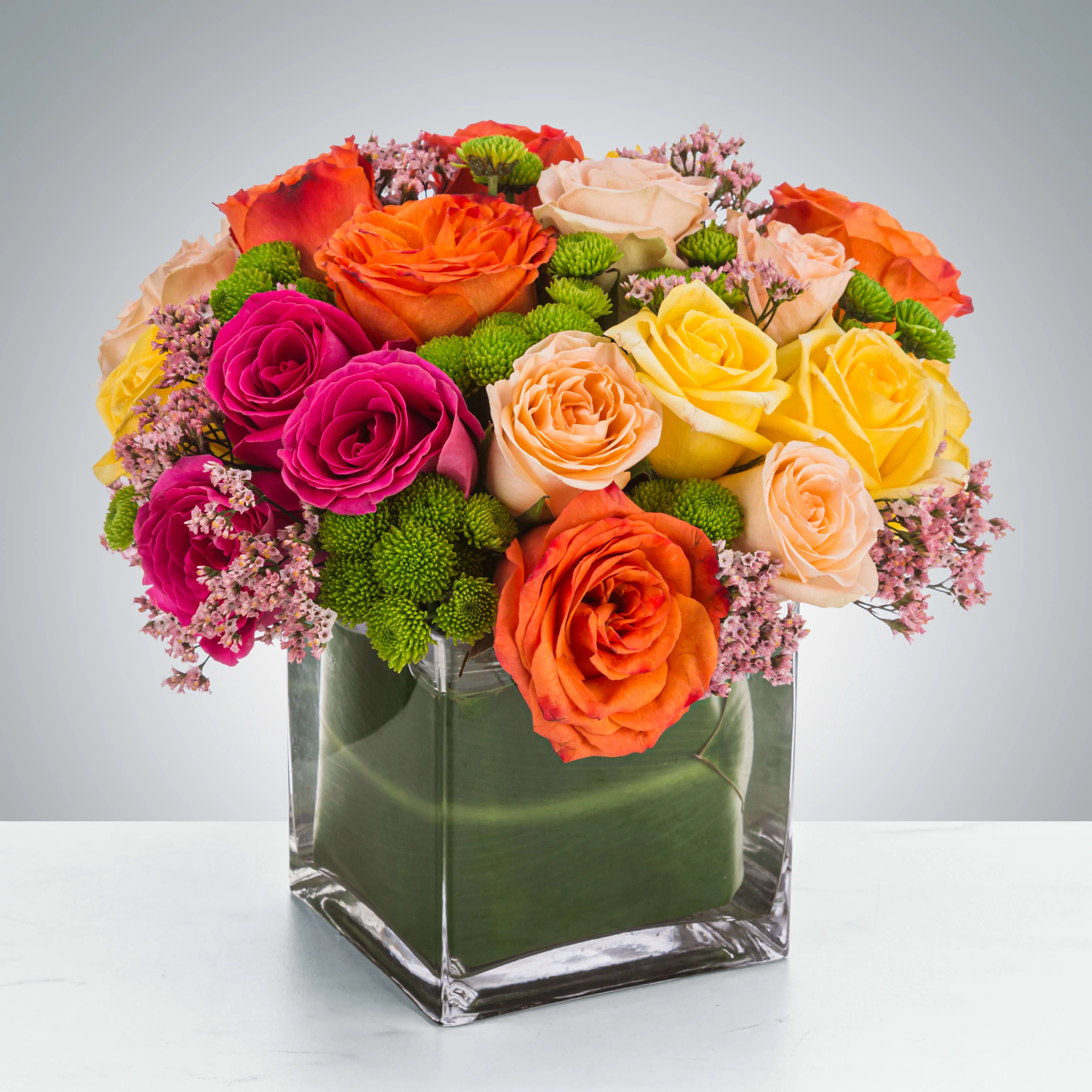Kaleidoscope  - A full-color explosion, Kaleidoscope by BloomNation™ is a beautiful gift for anybody you want to impress. Mother-in-law, your boss, a client, etc... this arrangement is a crowd pleaser and an eye-catcher.  Approximate Dimensions: 14"D x 14"H