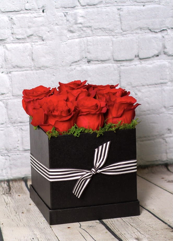 Modern Box of Roses ~ Black Box - Send some thing fun and modern with a rose pave in a crisp, black box. Perfect for anyone who appreciates simple, clean, and modern designs. Stands approximately 9" tall and 9" wide.  Please Note: Standard Delivery for this product occurs in the afternoon, between 2:30pm and 7pm. If you need it by a certain time, there is an option to select a timed window for scheduled deliveries.