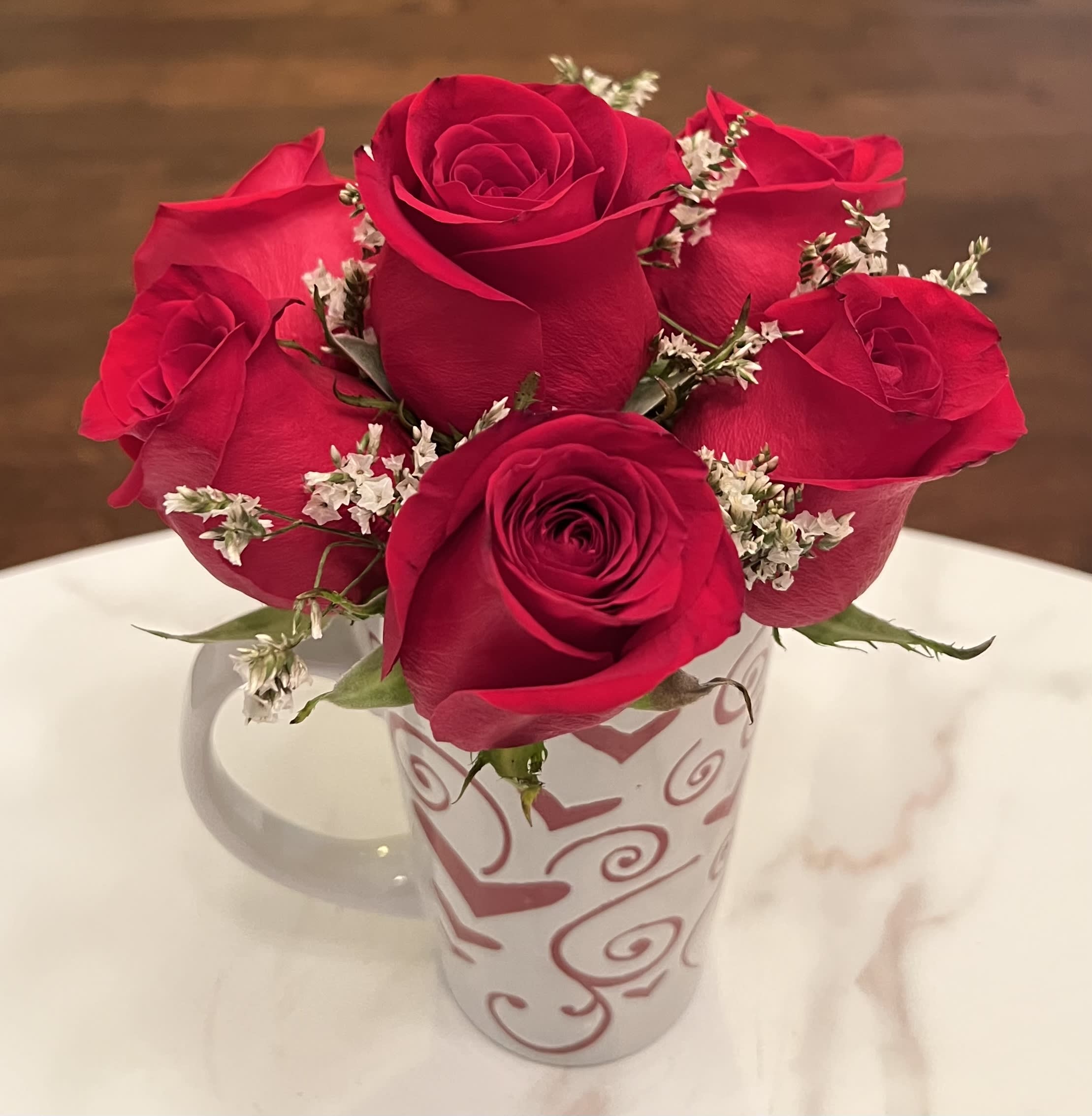 Lover’s Mug - Half dozen red roses in a heart mug.