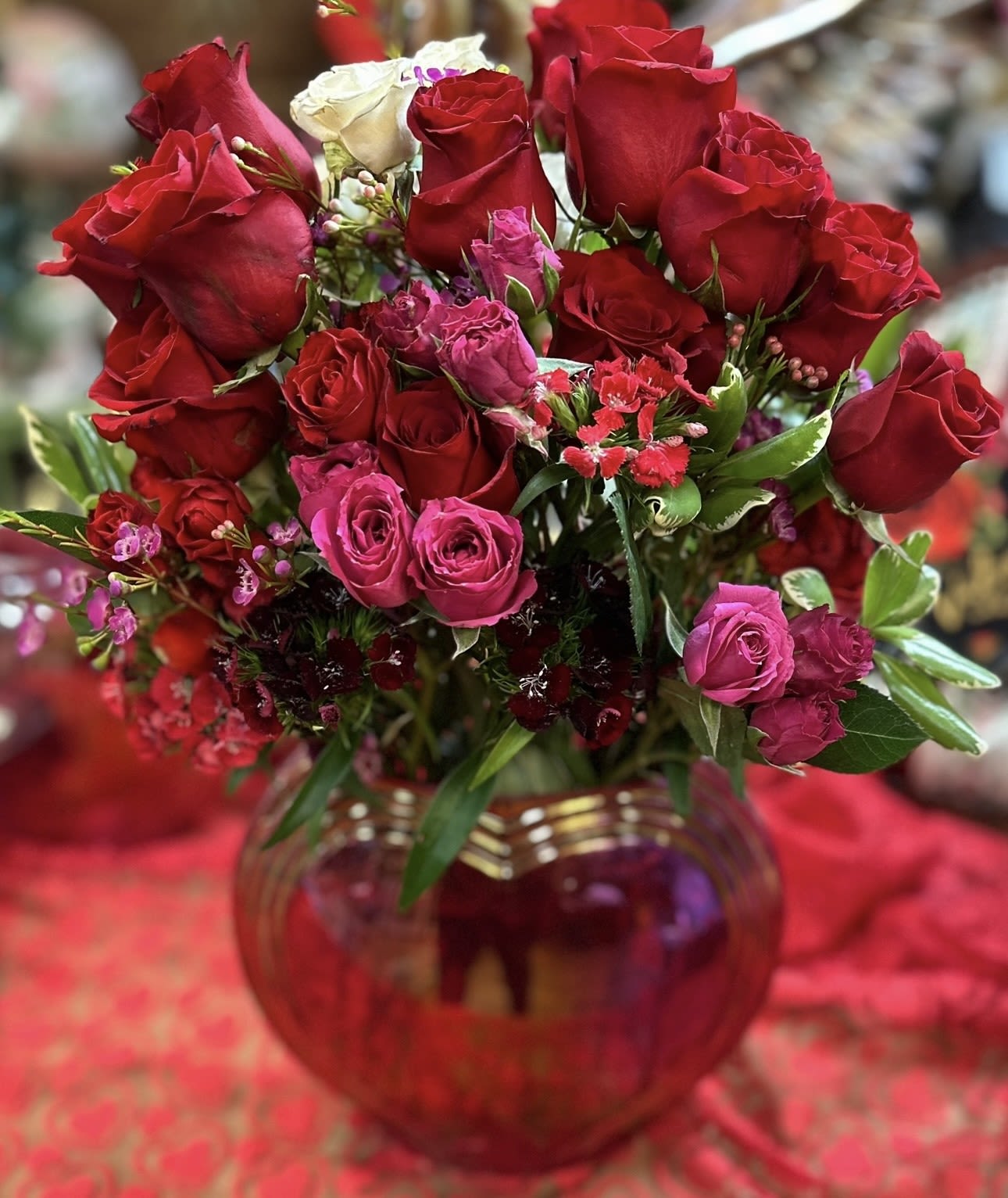 HEART FULL O LOVE - 1 DOZEN RED ROSES COUPLED WITH SPRAY ROSES, DIANTHUS, AND WAXFLOWER IN A LARGE IRRIDESCENT HEART VASE  SURE TO PROVIDE THE WOW FACTOR!!!!