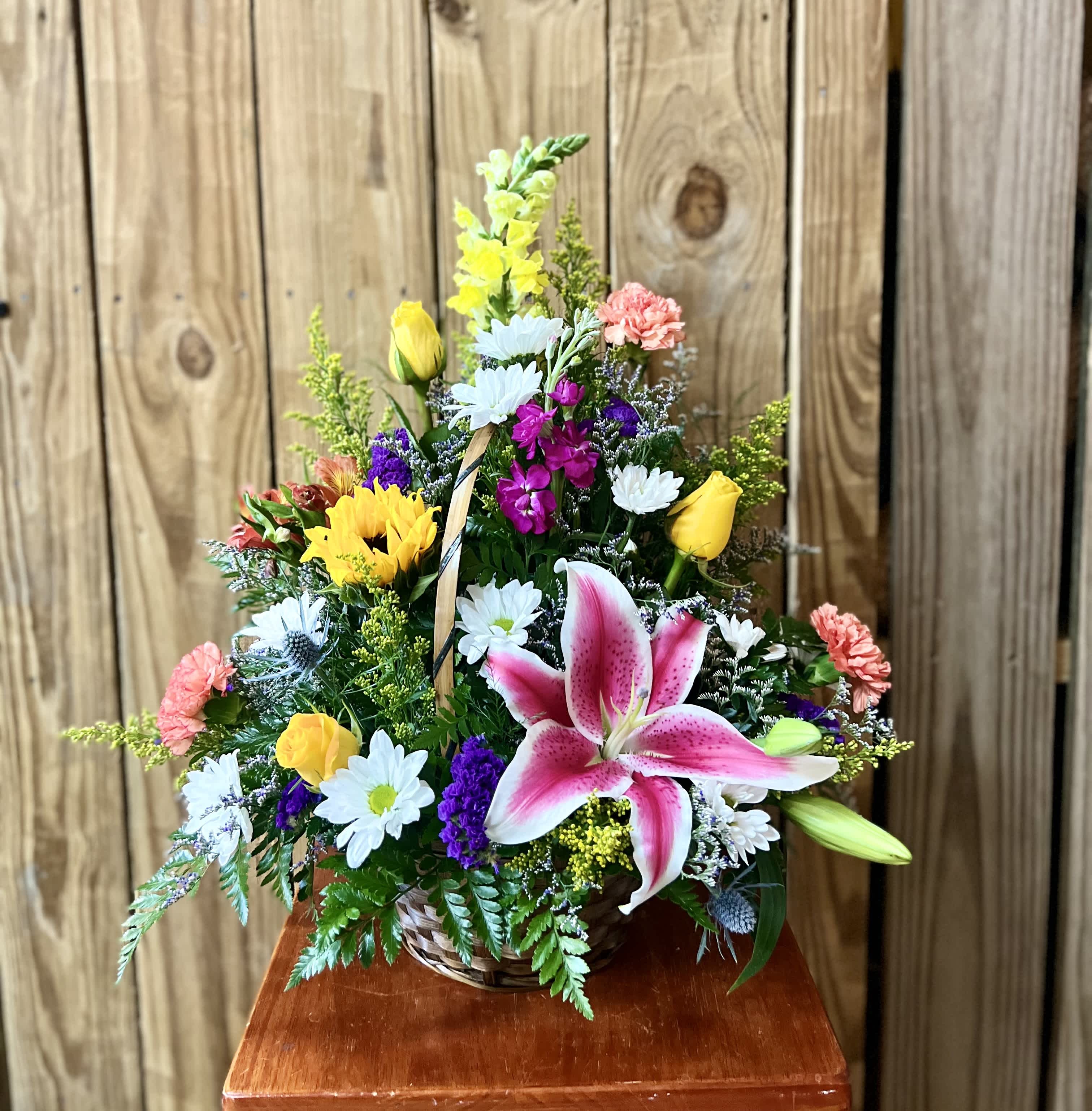 Designer's Choice Wicker Basket  - A wicker basket filled with bright colorful flowers specially handpicked by our lead designers. Choose from 3 Choices: 8"  10"  or  12" 
