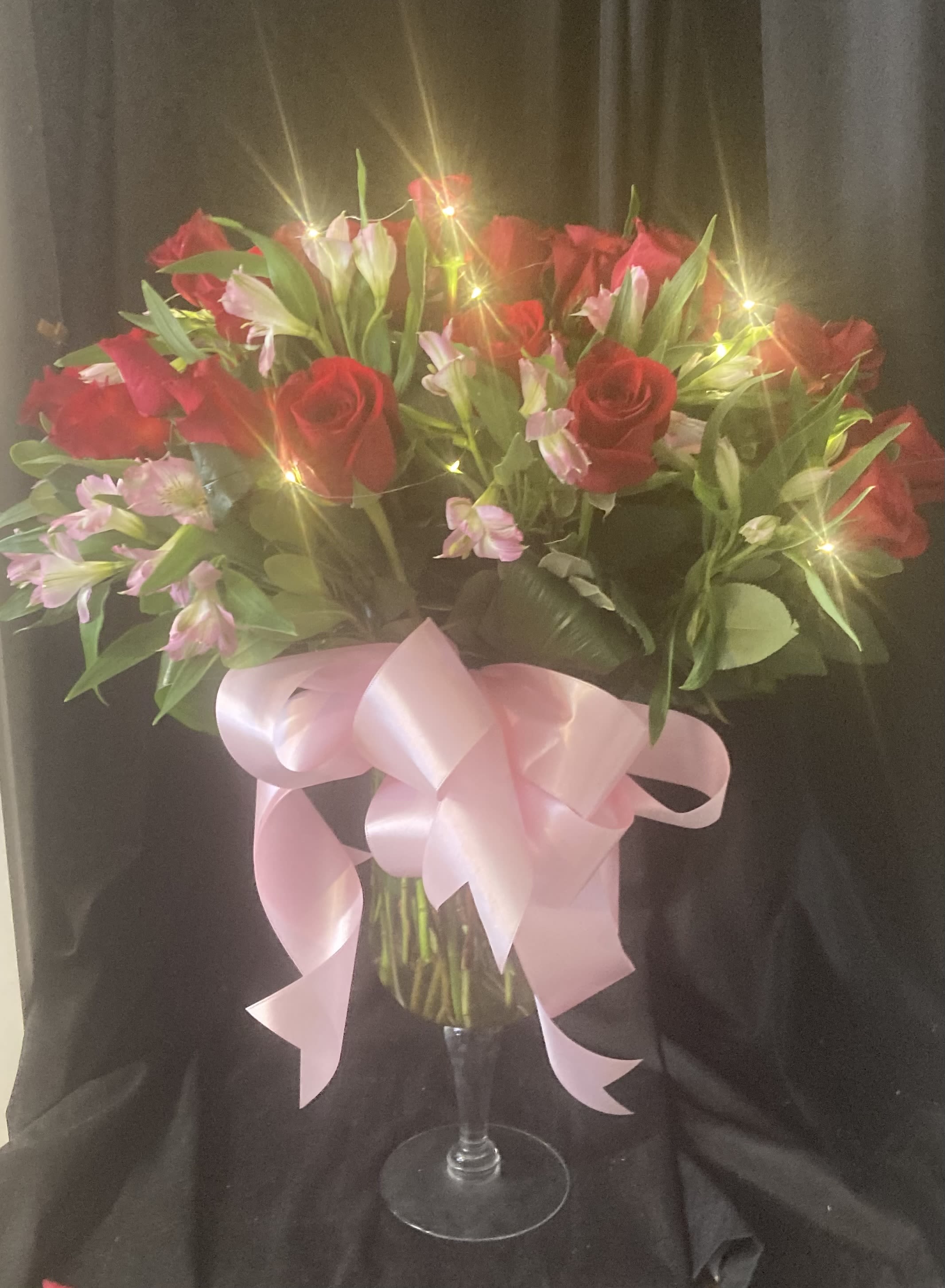 LIT UP ROSES - DOZEN RED ROSES, ALSTROMERIA, GREENS AND A BOW IN A CUSTOM VASE