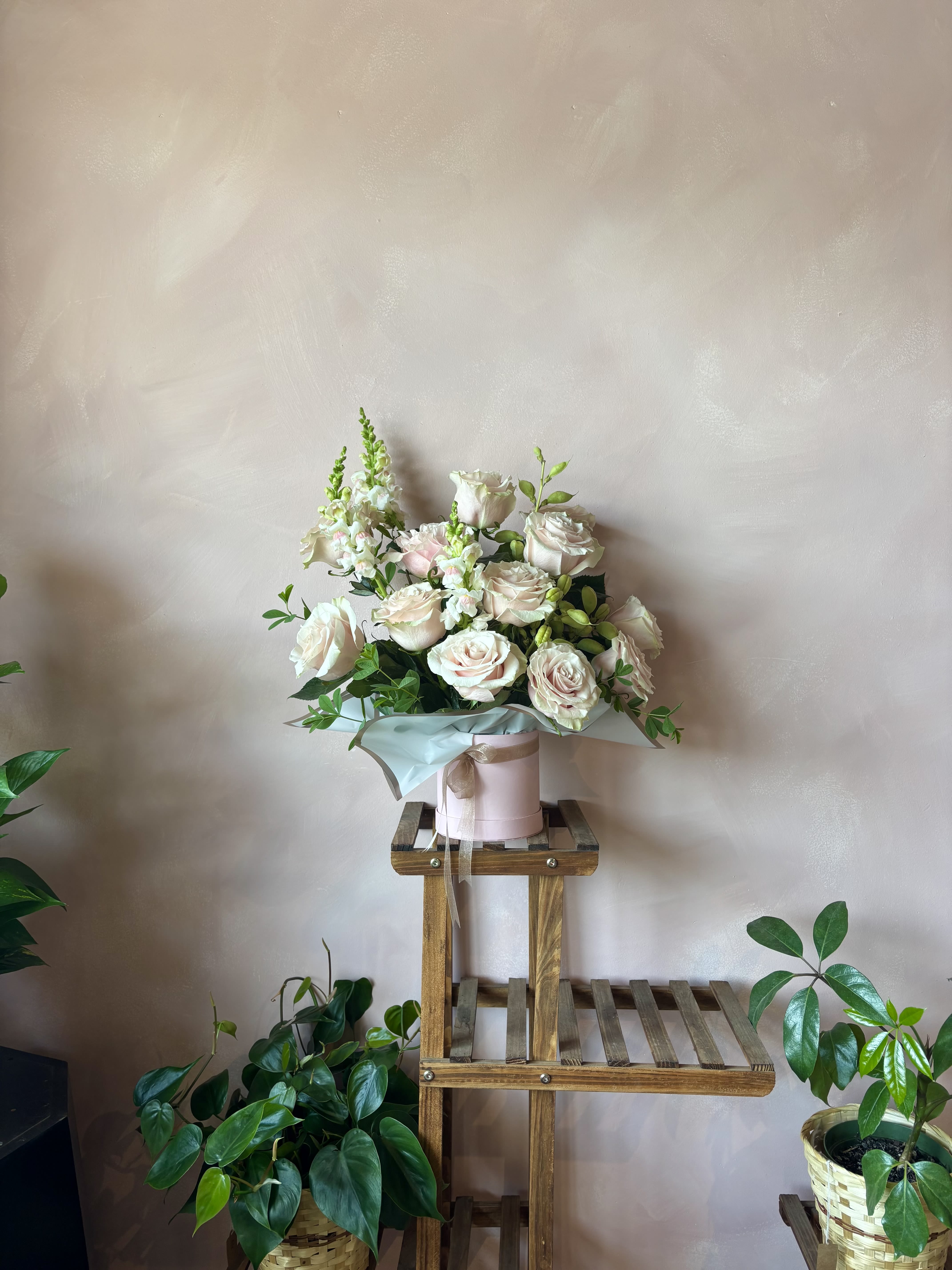 Sweet Blush - One dozen stunning roses paired with creamy complimentary blooms and lush greenery in a premium gift box. A gentle and timeless arrangement for any sweet moment.