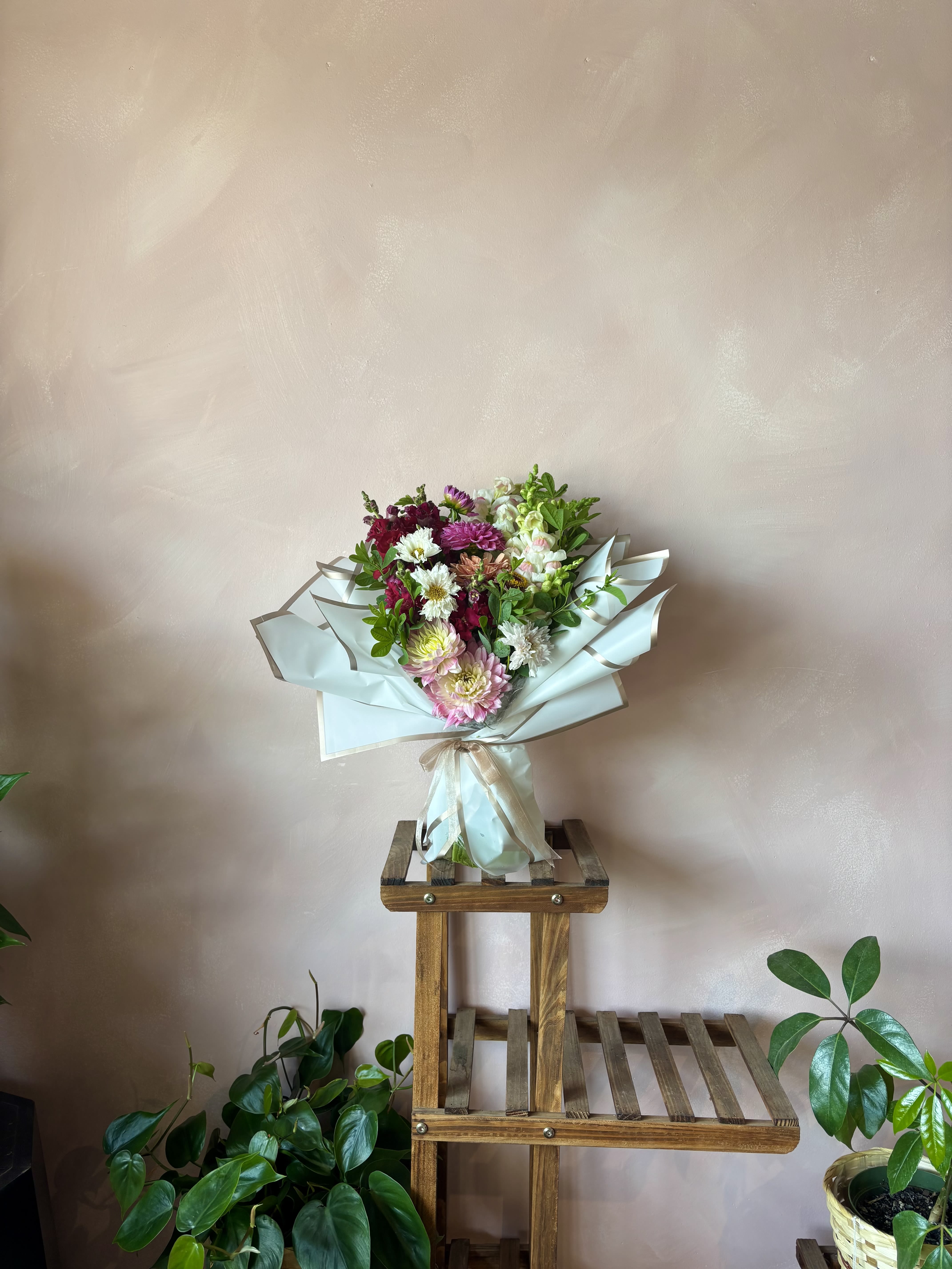 Wild Bloom Wrap - Vibrant mix of fresh assorted blooms in our premium wrapping and finished off with a temporary hydration pack to ensure freshness. Perfect way to say "I love you"