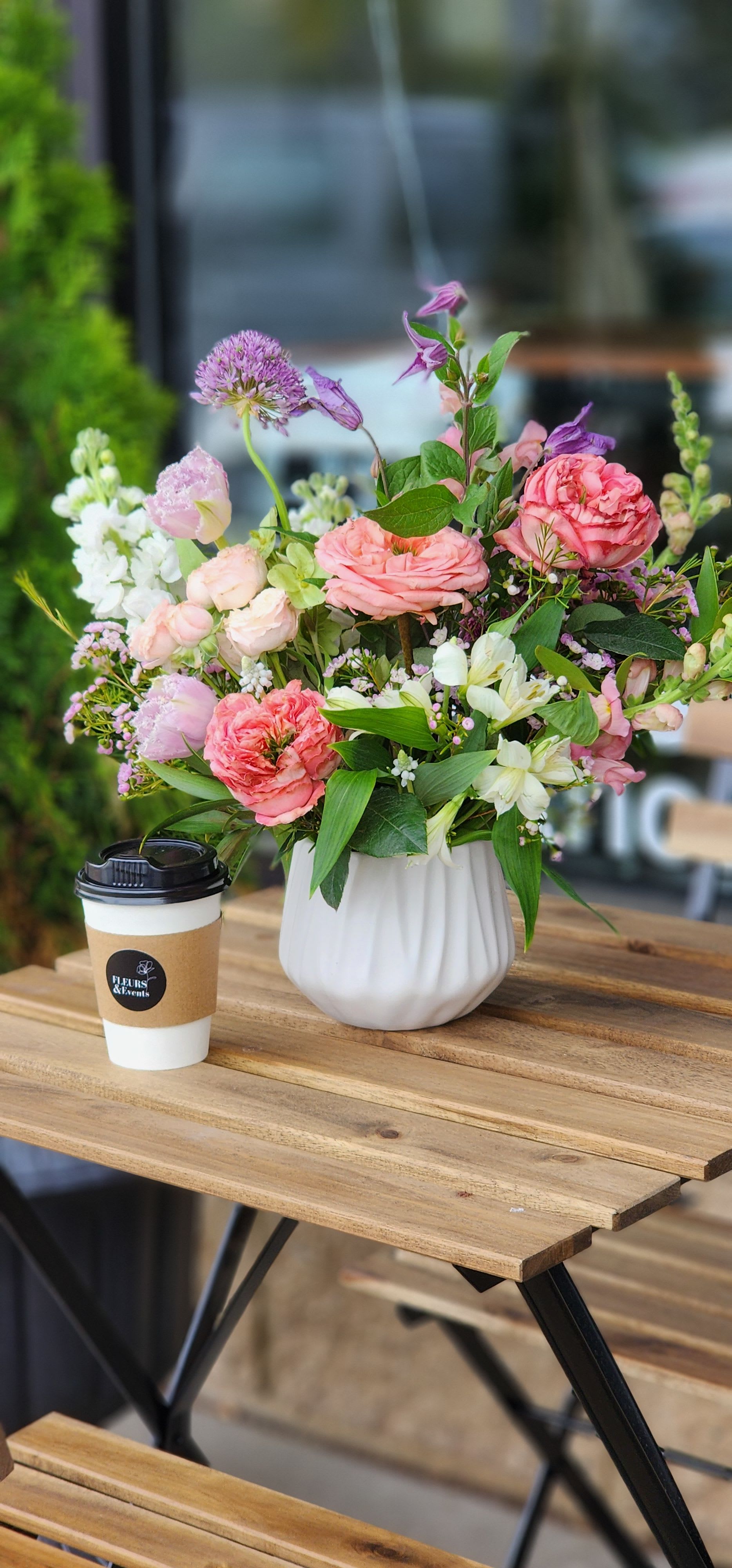 Raspberry Mocha + Blooms - This Valentine’s Day, treat yourself (or someone you love) to a cozy raspberry mocha latte paired with a charming Valentine’s petite arrangement, designed in a opaque ceramic vase. Sweet, simple, and full of love—because flowers and coffee are always a good idea.  Please specify your choice during checkout- hot or iced.  Valentine’s Day preorder required. Pickup only at this time. Limited availability.