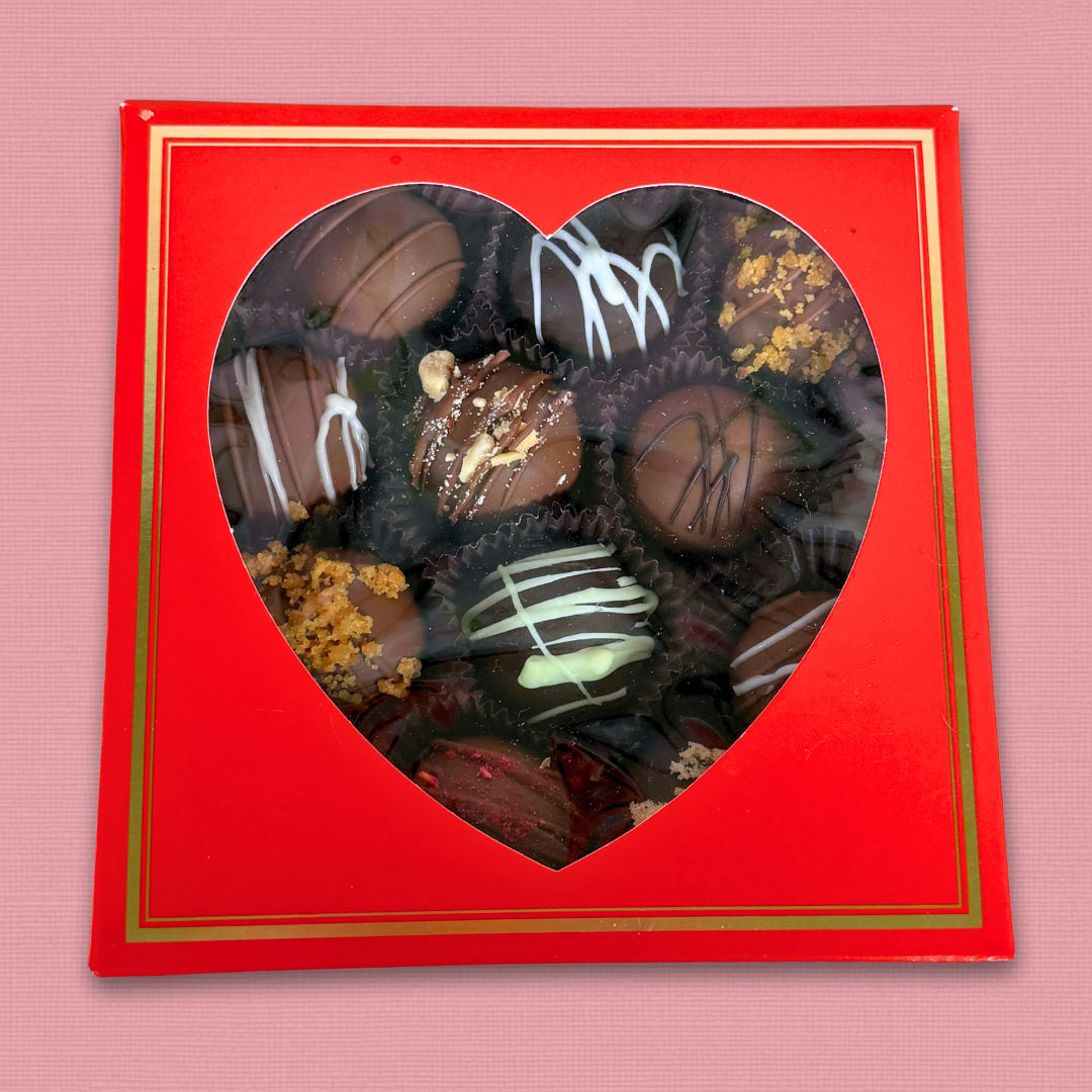 Park Edge Sweet Shoppe Truffle Box - Park Edge Sweet Shoppe's Truffle Box is a fantastic way to add a sweet treat to your flowers this Valentine's Day. This red square box has a heart shaped window so you can peek in and see all of the goodies awaiting you inside! Each box comes with a variety of 12 delicious truffles for you and your Valentine to savor and enjoy!