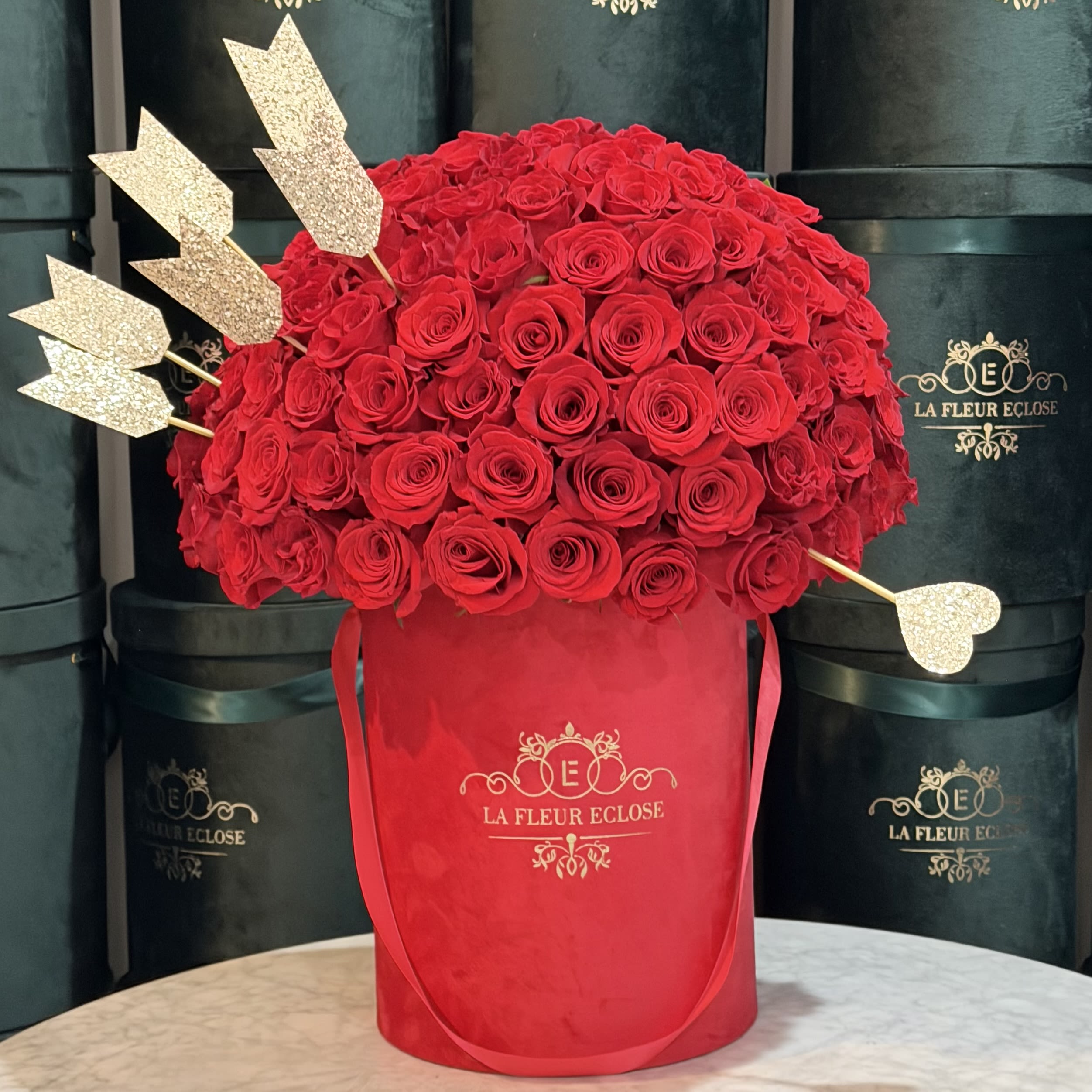 50 Red Roses — Signature Box - An elegant arrangement of 50 premium red roses presented in our signature La Fleur Éclose luxury box.  The perfect balance of sophistication and timeless romance — ideal for declarations of love, anniversaries, meaningful apologies, and life’s unforgettable moments. The deep red roses symbolize passion, respect, and powerful emotions.   Hand-arranged in a dense, dome-style design  Long-lasting, premium-quality fresh roses  Signature luxury box  Gift-ready — no additional wrapping needed  Size: Signature Rose Count: 50  ⸻   Deluxe Version — 75 Roses  Looking for a more dramatic statement? Upgrade to the Deluxe version with 75 roses. This arrangement is noticeably larger, fuller, and delivers a true “royal” impression. Perfect for proposals, milestone celebrations, and unforgettable wow-moments.