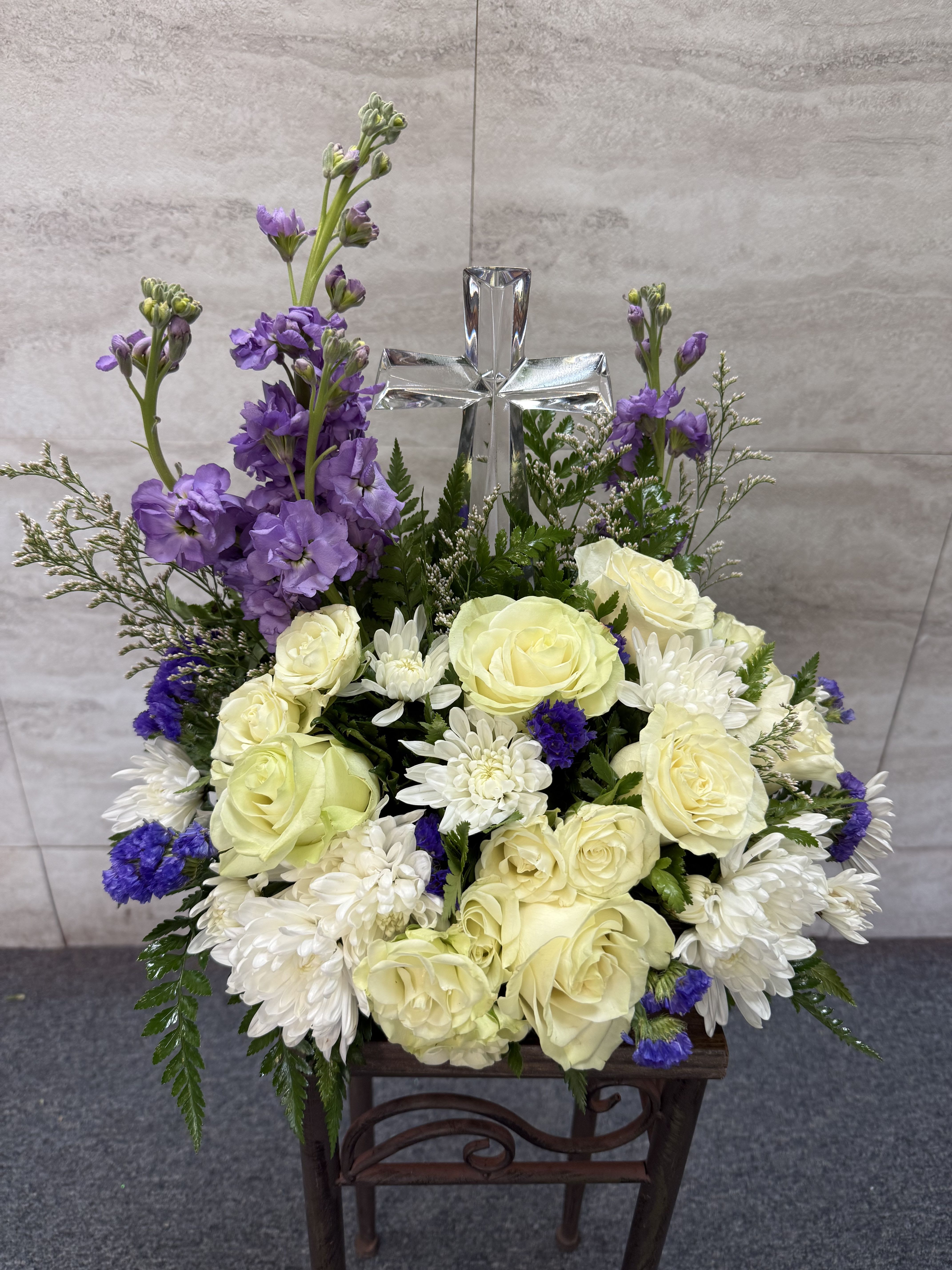 Poised with Love Bouquet - Cross Bouquet to remember a loved one, with an assorted of purple/ lavender colors.