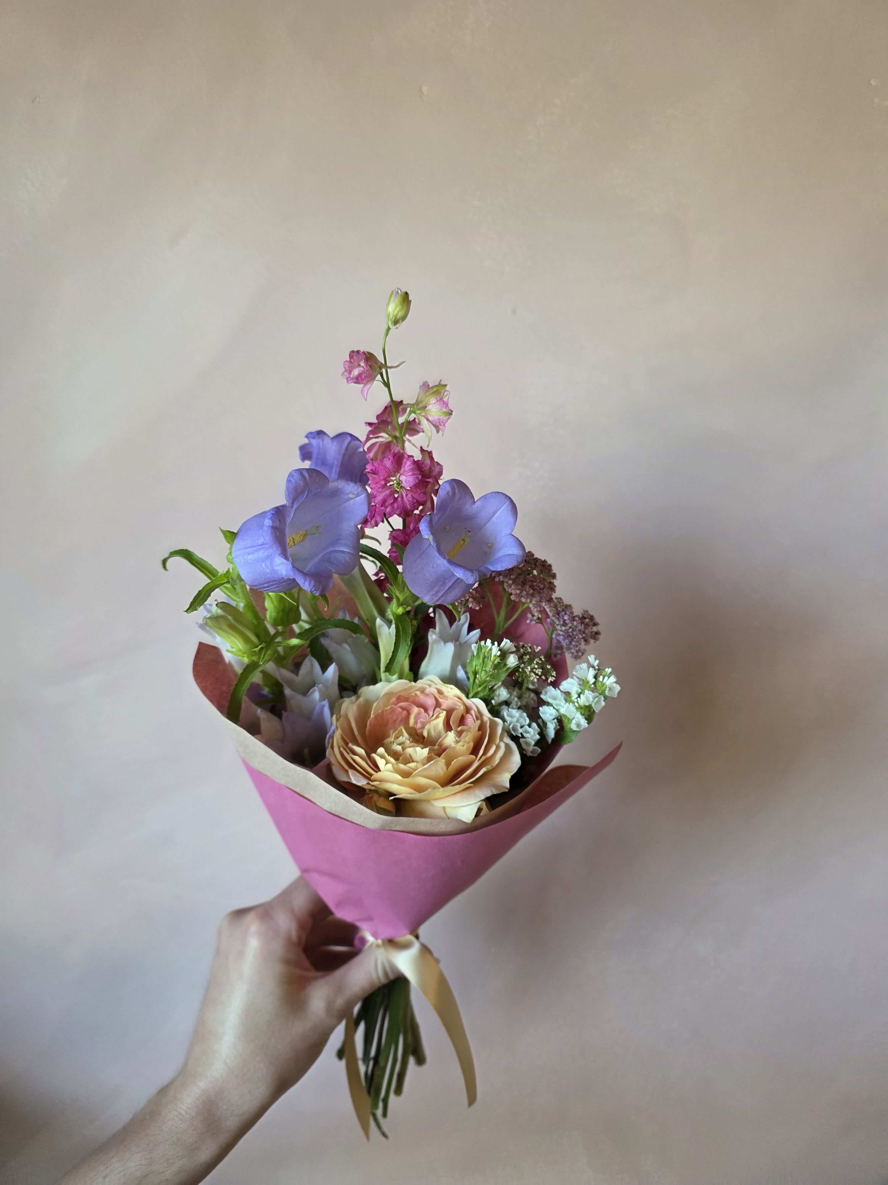 The Little Things - A delicate and sweet assortment of 5-7 blooms in a simple wrap and finished off with a temporary hydration pack to ensure freshness!