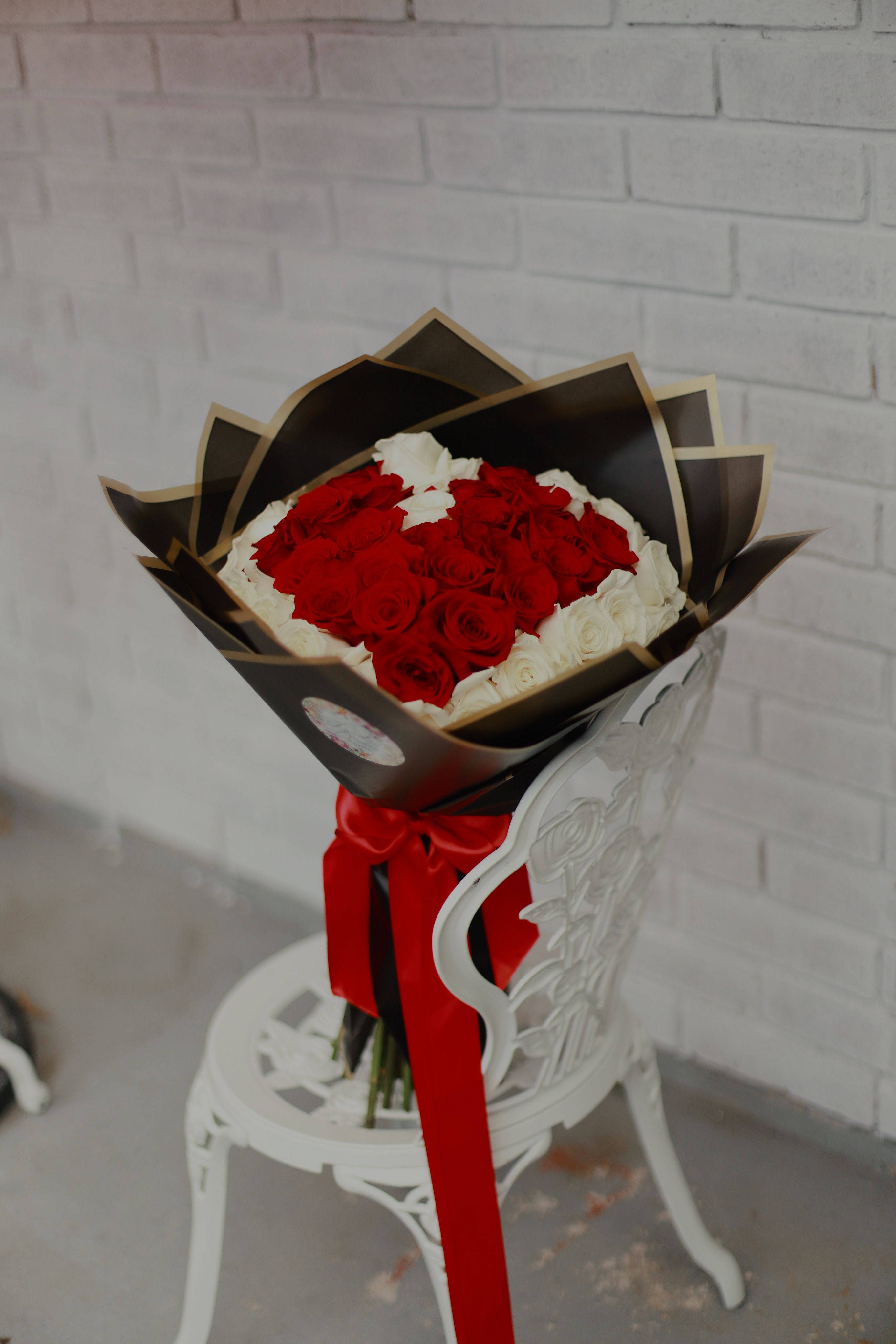 50 Rose heart in the middle Ramo Bouchon  - 50 beautiful long stem roses with a heart shape in the middle made with the roses and wrapped in korean wrap paper. The next size up is the 100 rose bouquet 