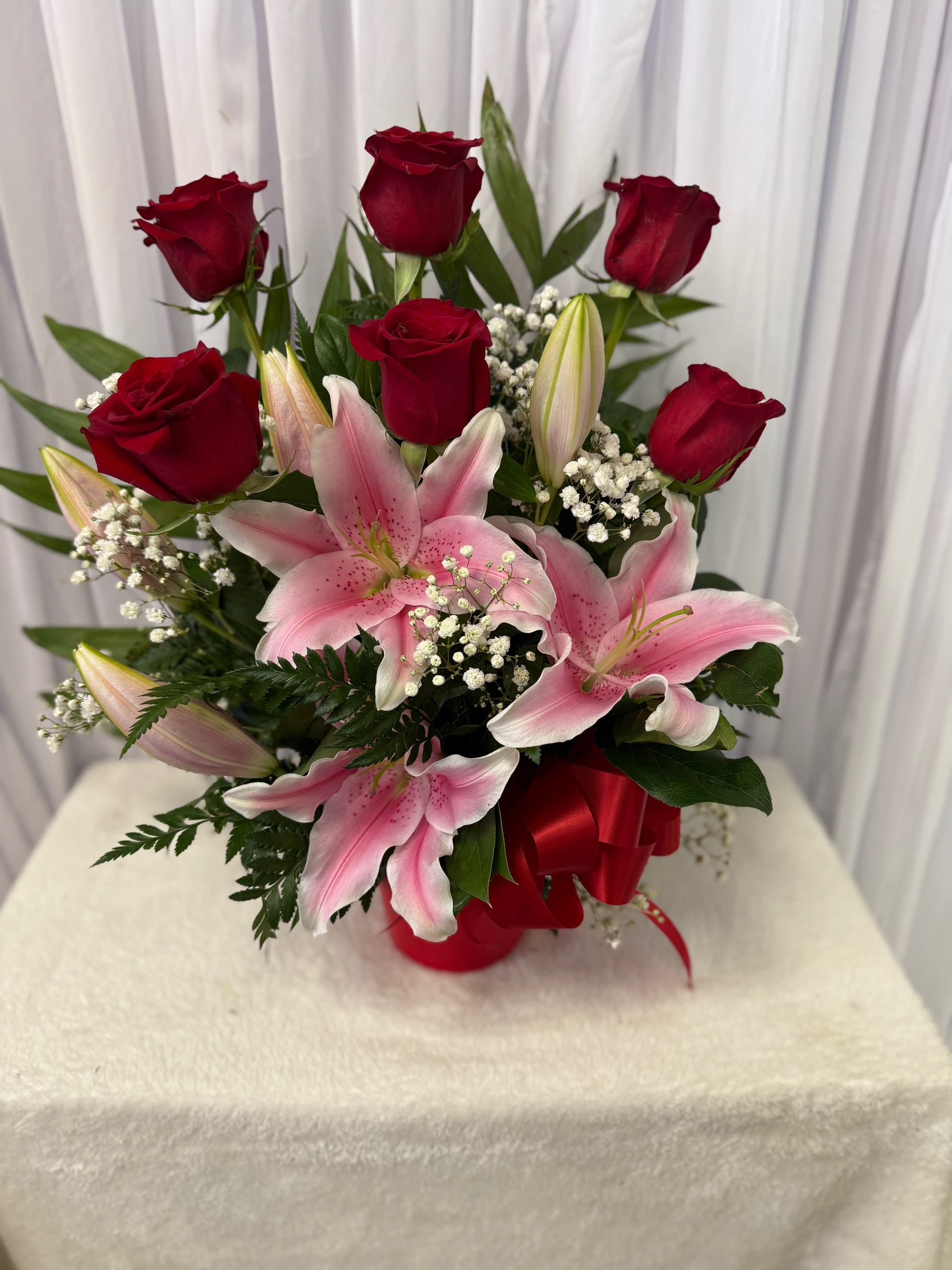 EVE 36 - Disclaimer in case of SUBSITUTIONS:   for green and blooming plants, similar plants may be substituted of equal or greater value. For flowers, we will make every attempt to match the flower type / color but may substitute with another color or type of flower. If the container / vase shown online is not available, a similar container / vase will be used. Bears or other gift items may be substituted as well. Want to check on availability? If it makes you feel more comfortable about the purchase, then we encourage you to call or email us to check on the latest availability of certain products. We would be glad to give you the most current, up-to-date status on our inventory. Deluxe - Additional flowers will be added to enhance the bouquet. Premium - We will add more blooms and select the highest quality flowers we offer in this style.