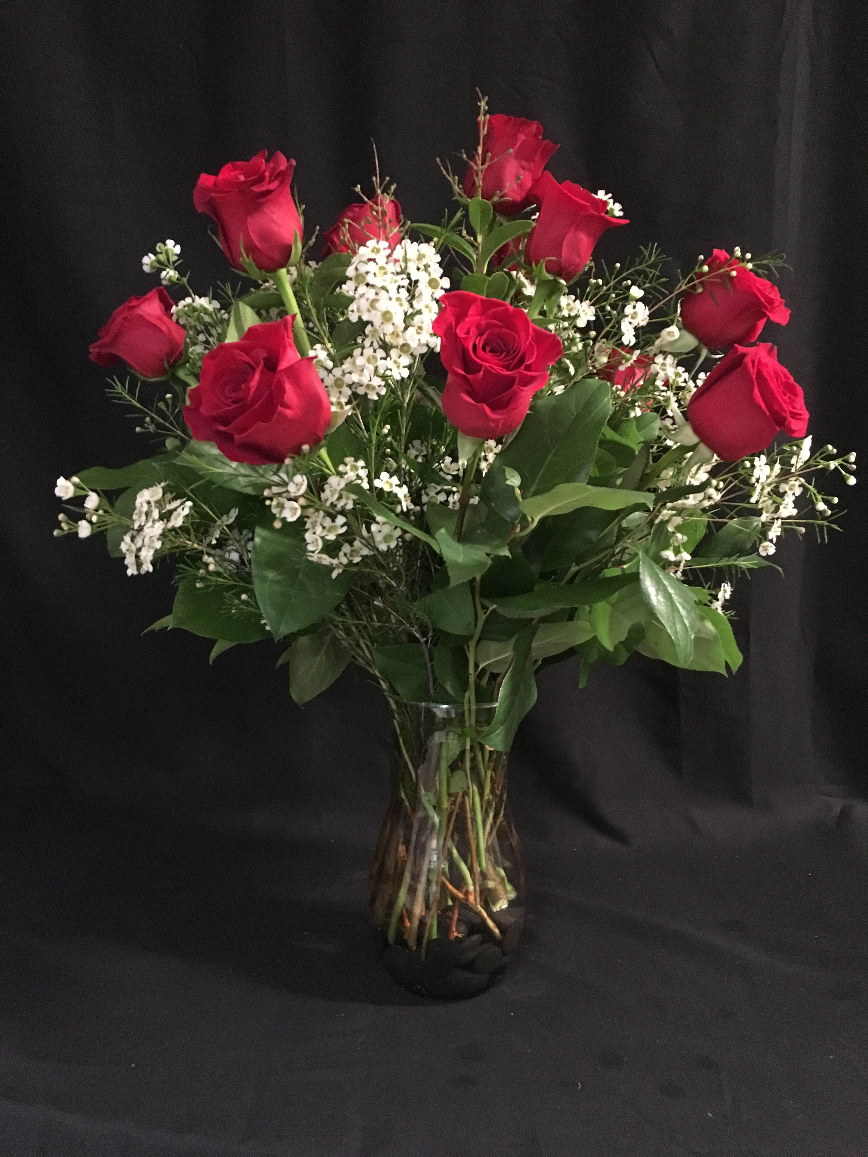 Endless Love - These dozen red roses with baby's breath are classic! Perfect romantic gift for any occasion   APPROXIMATE DIMENSIONS: 25" H X 18" W