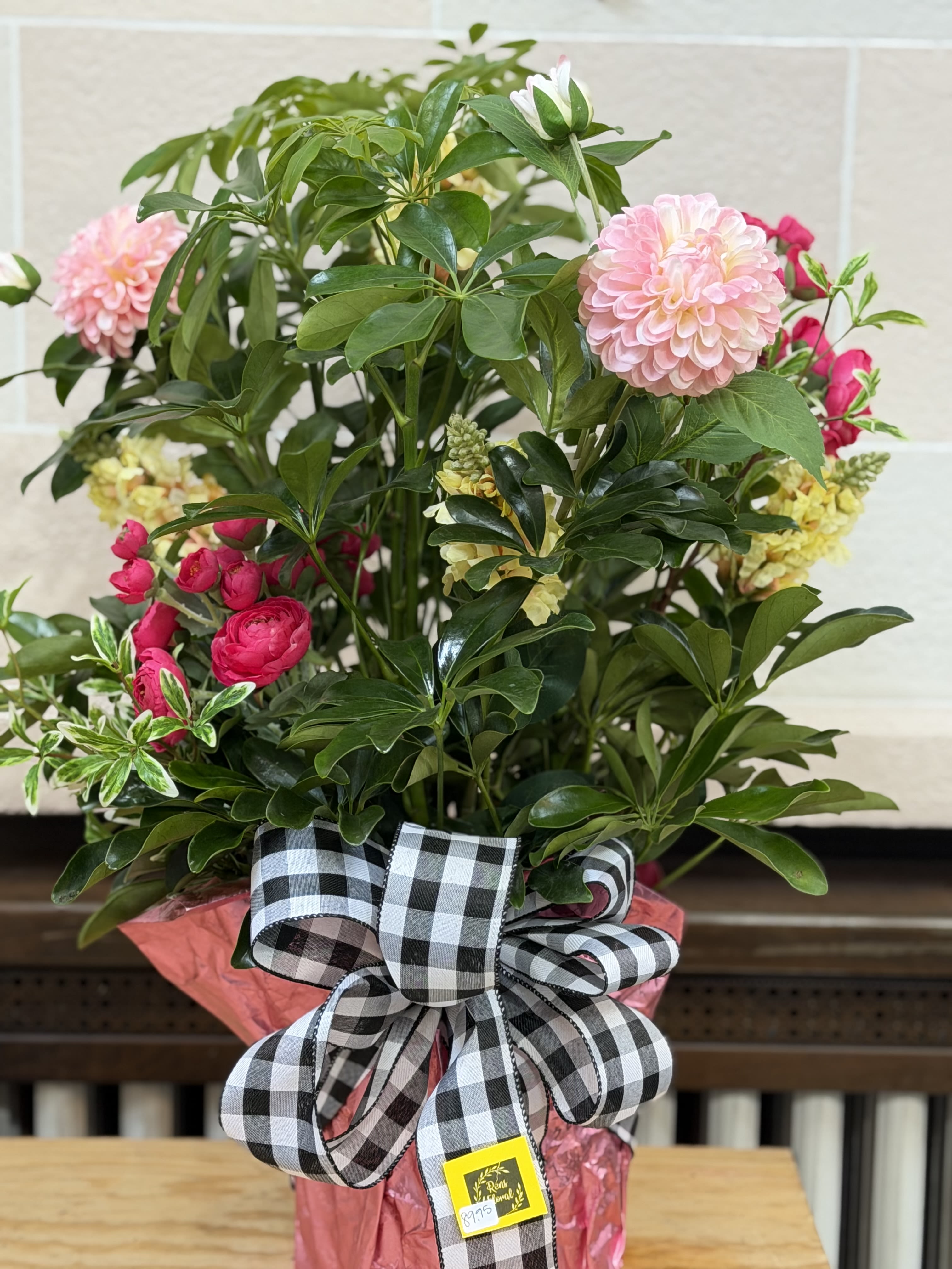 Wrapped Hawaiian Arbicola with Artificial  - An 8" wrapped Hawaiian Arbicola with feminine artificial flowers added. 